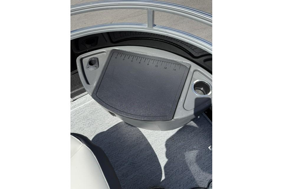 2026 Sun Tracker Fishin' Barge 20 DLX console with integrated ruler and cup holder.