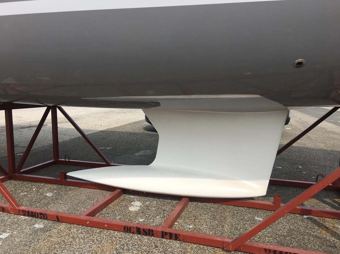 2025 Beneteau Oceanis 40.1 sailboat keel on a red metal stand.