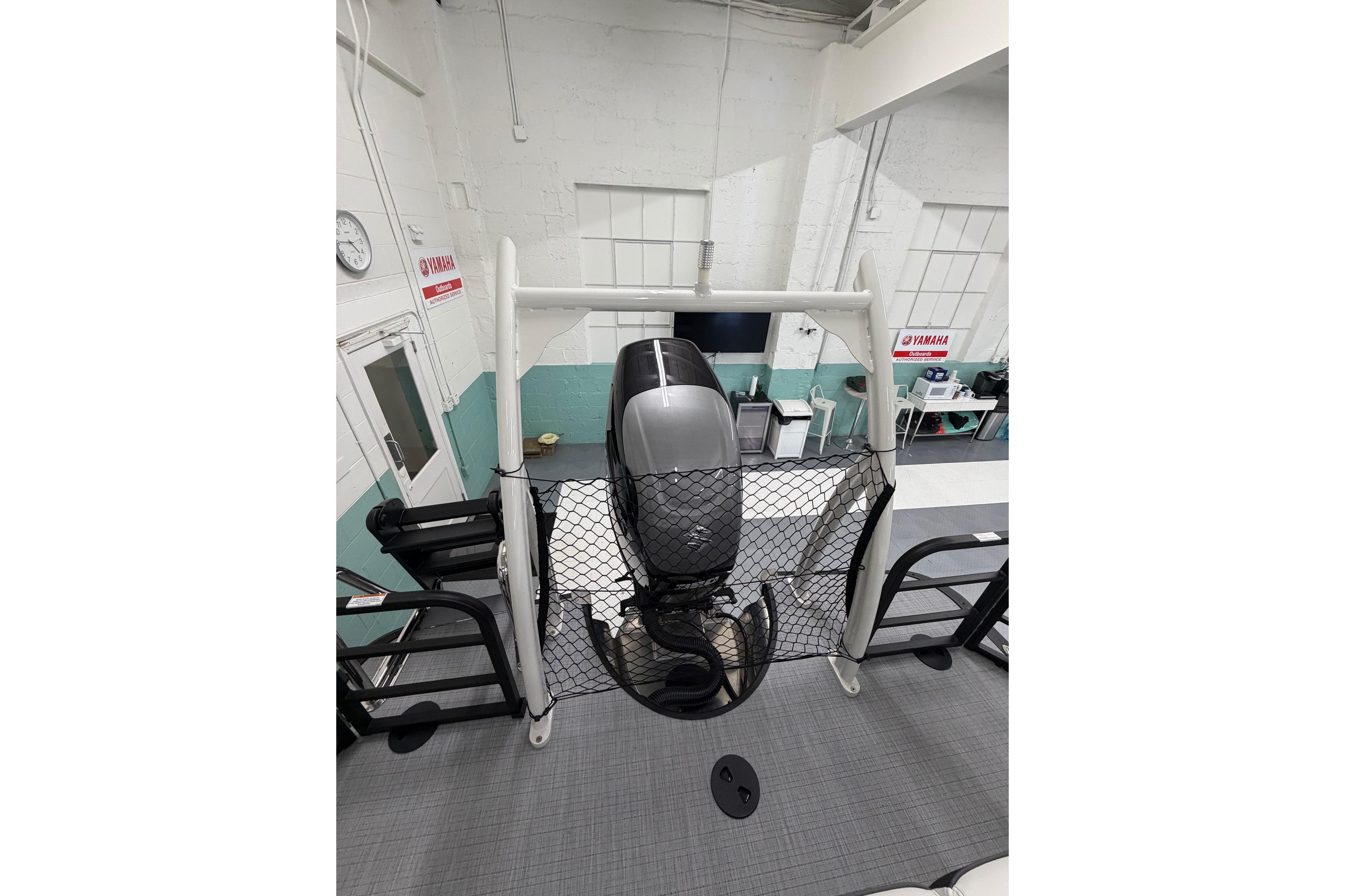 2026 South Bay 525SB2 boat with Yamaha engine in a workshop setting.