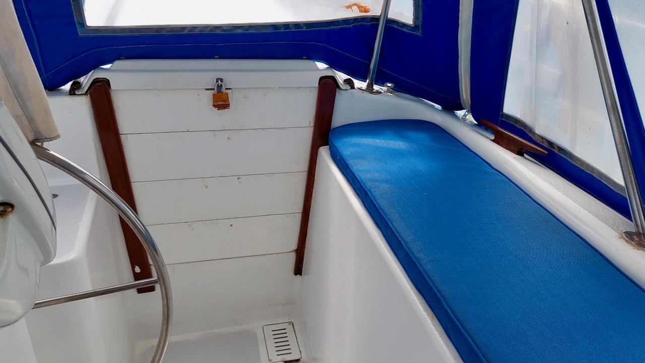1981 Morgan Out Island 41 cockpit with blue seating and white interior.