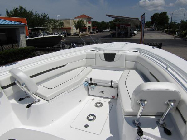 2024 Wellcraft 352 Fisherman boat interior with white seating and storage compartments.