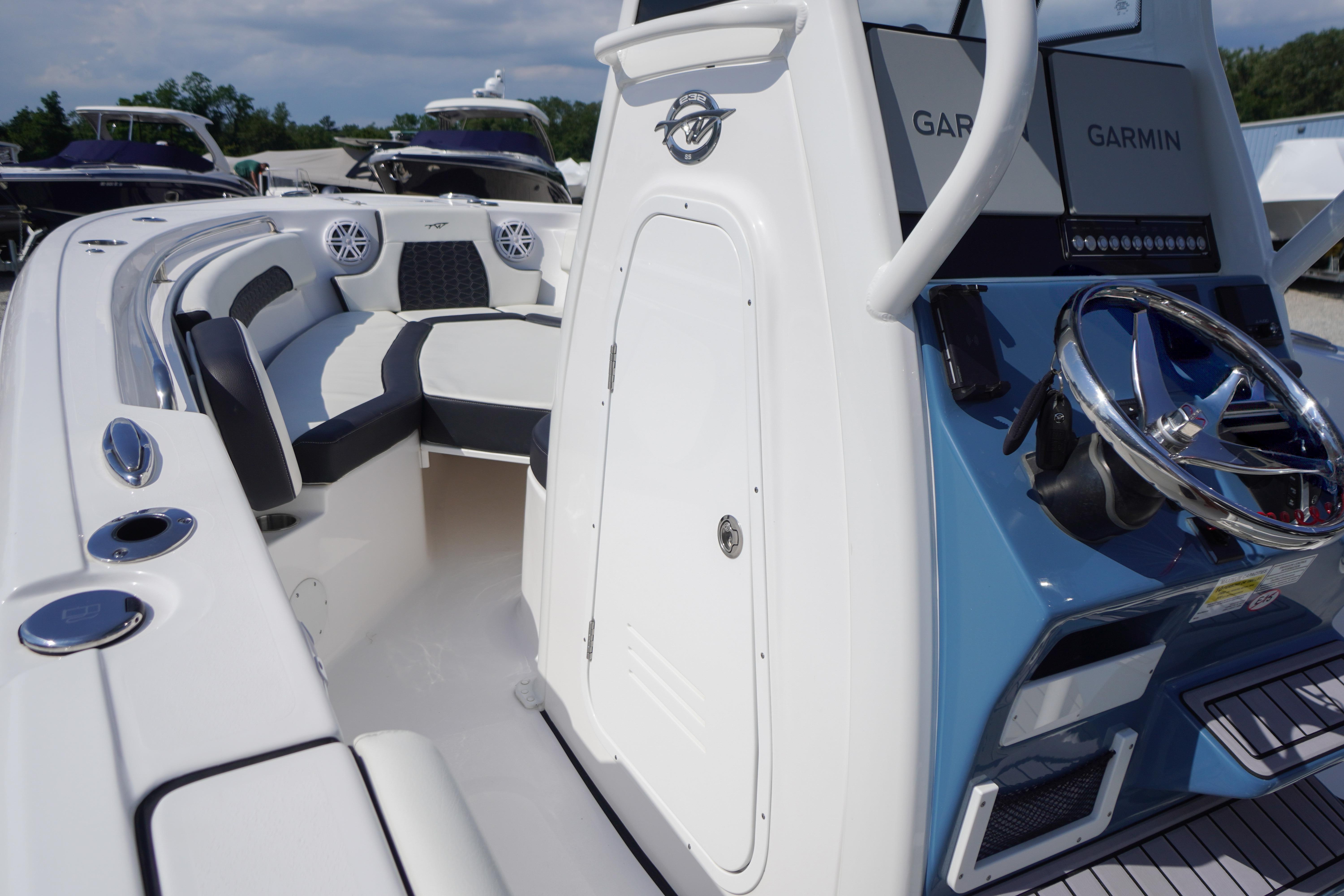 2025 Tidewater 232 SS boat interior with modern helm and seating area.