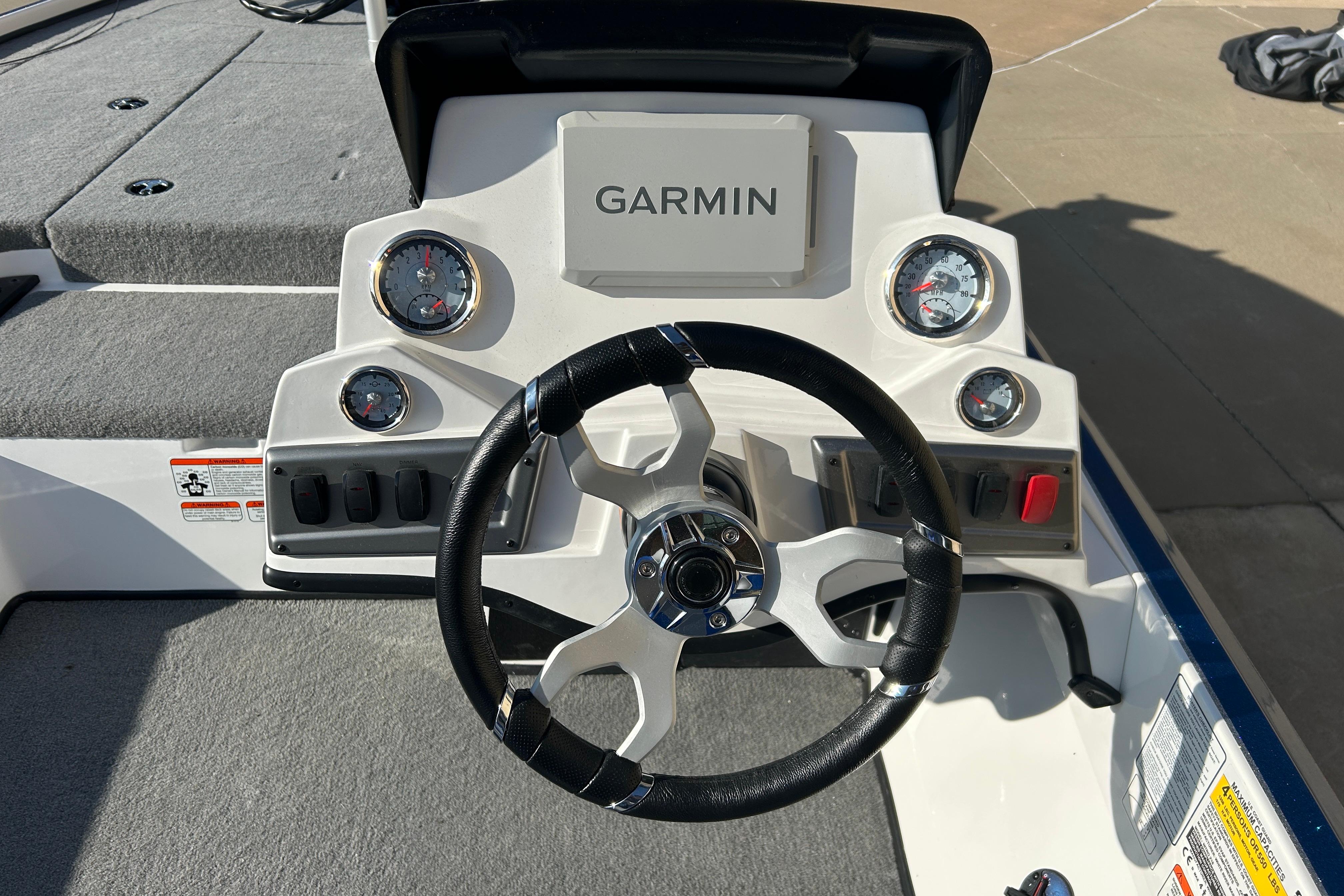 Steering console of 2025 Nitro Z18 Pro boat with Garmin display and gauges.