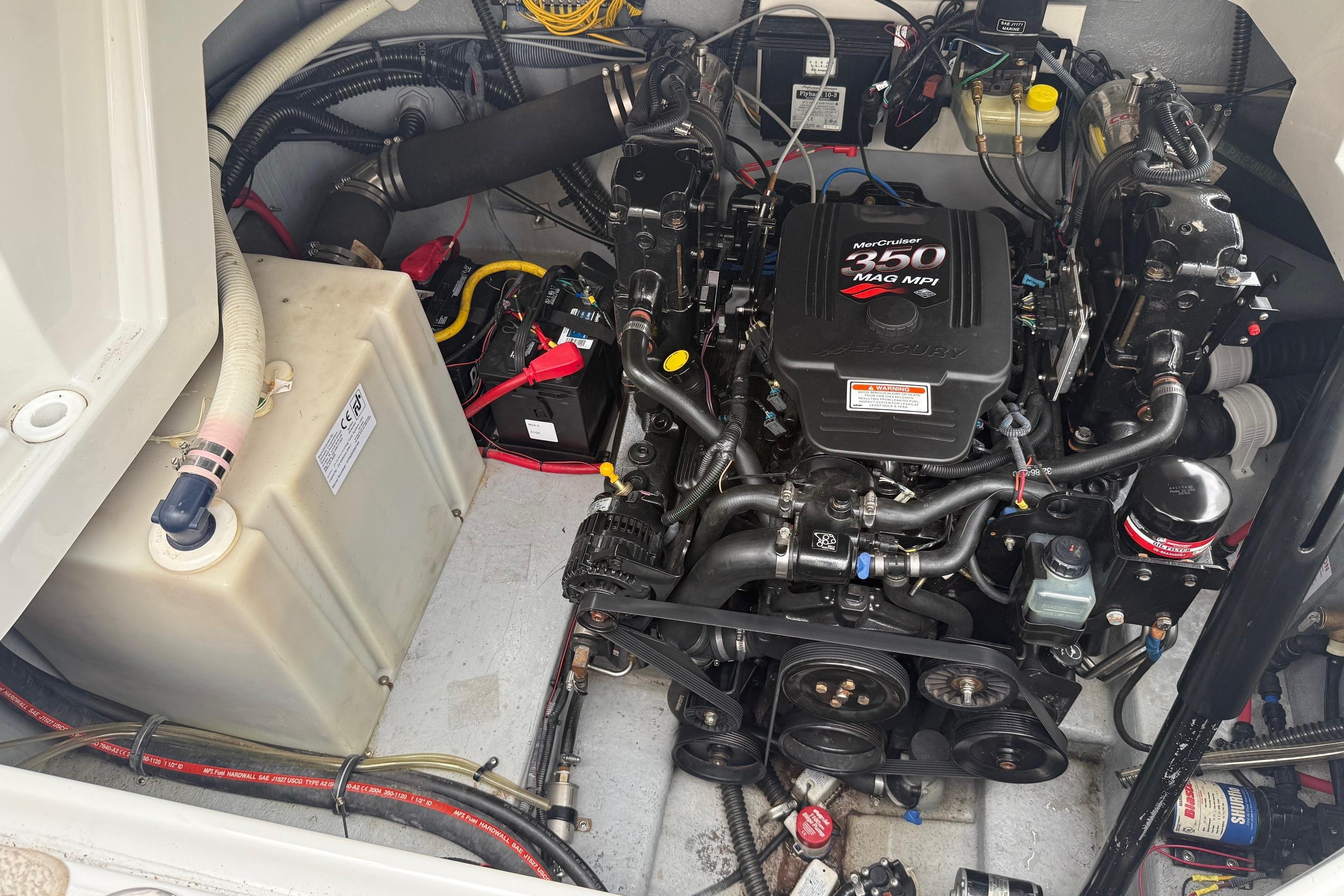 Engine compartment of a 2005 Crownline 250 CR boat with MerCruiser 350 MAG MPI engine.
