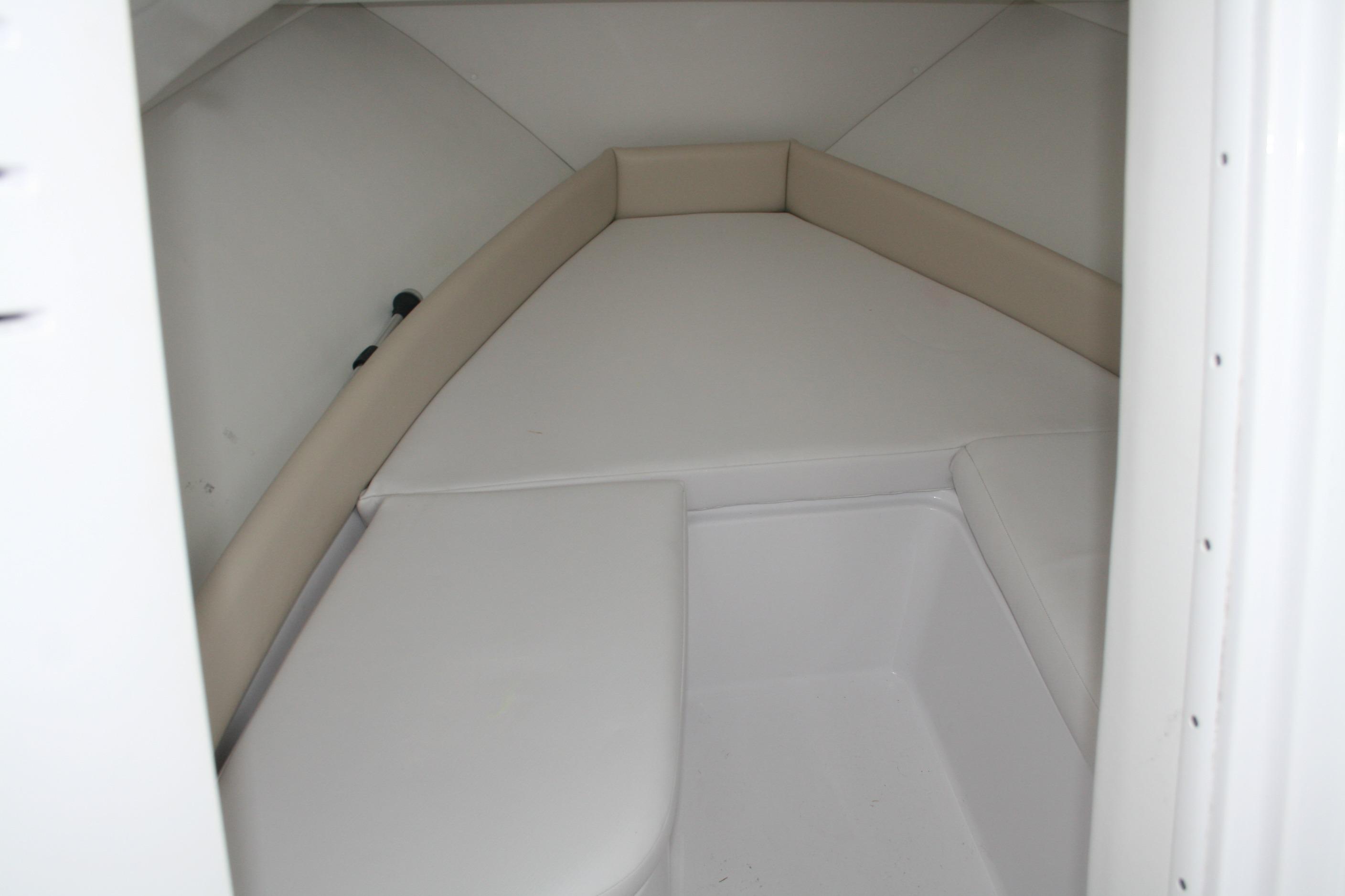 2013 Pro-Line 20 Express cabin interior with white cushioned seating.