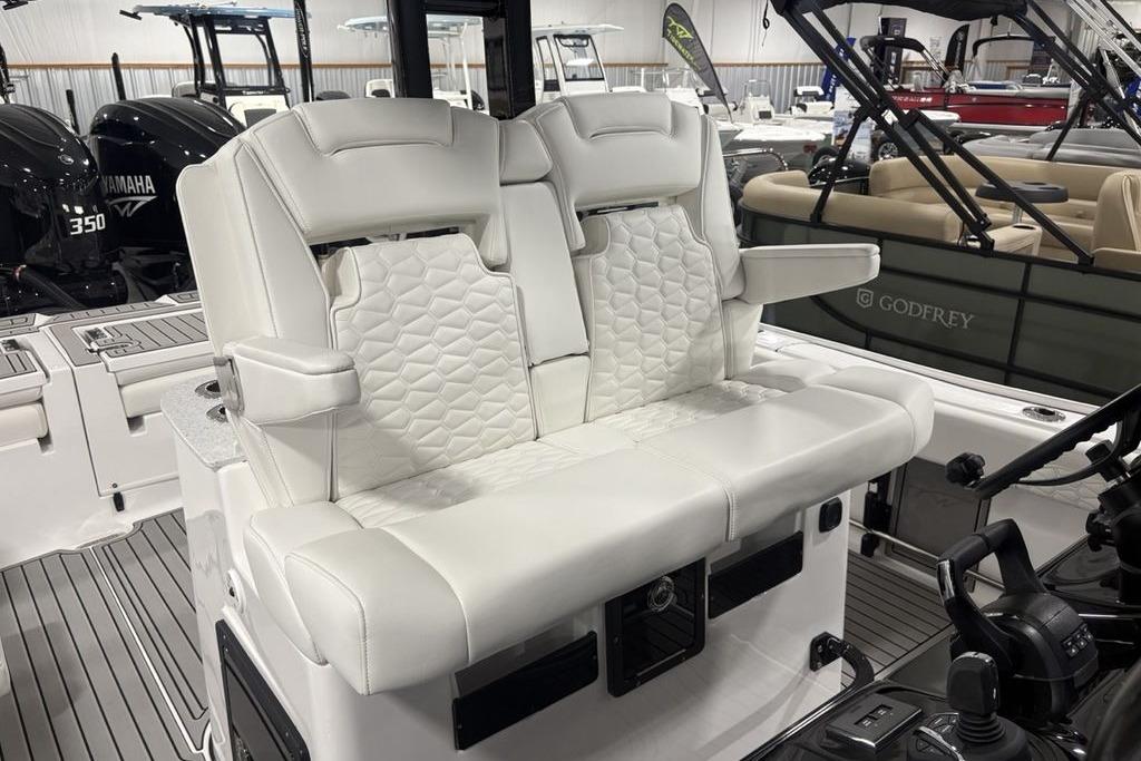 2026 Tidewater 3100 Carolina Bay boat interior with luxurious white seating and modern controls.