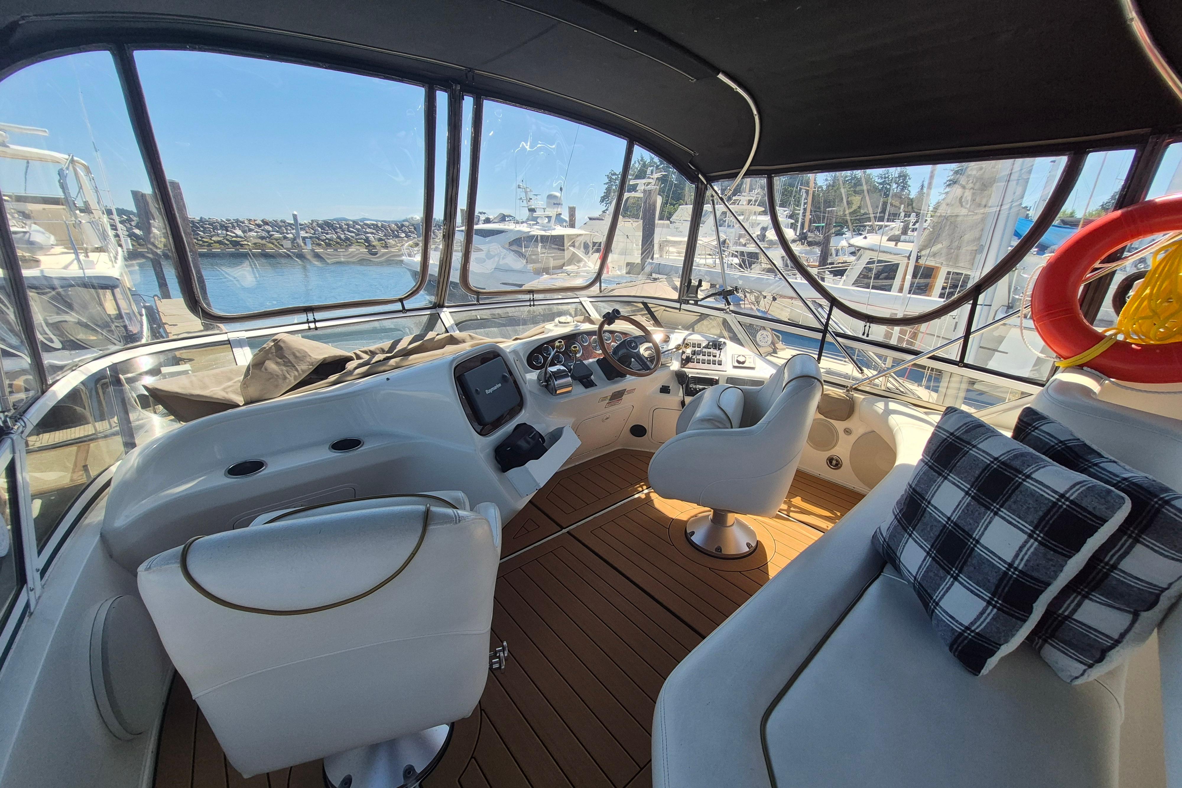 Interior view of a 2000 Sea Ray 380 Aft Cabin yacht at a marina.