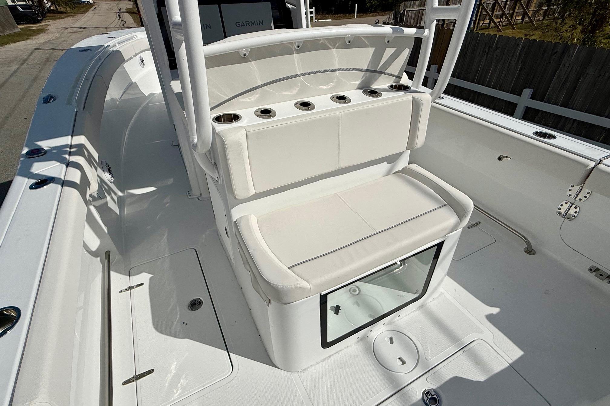 2026 Sea Hunt Ultra 285 Coffin Box boat interior with cushioned seating and storage.