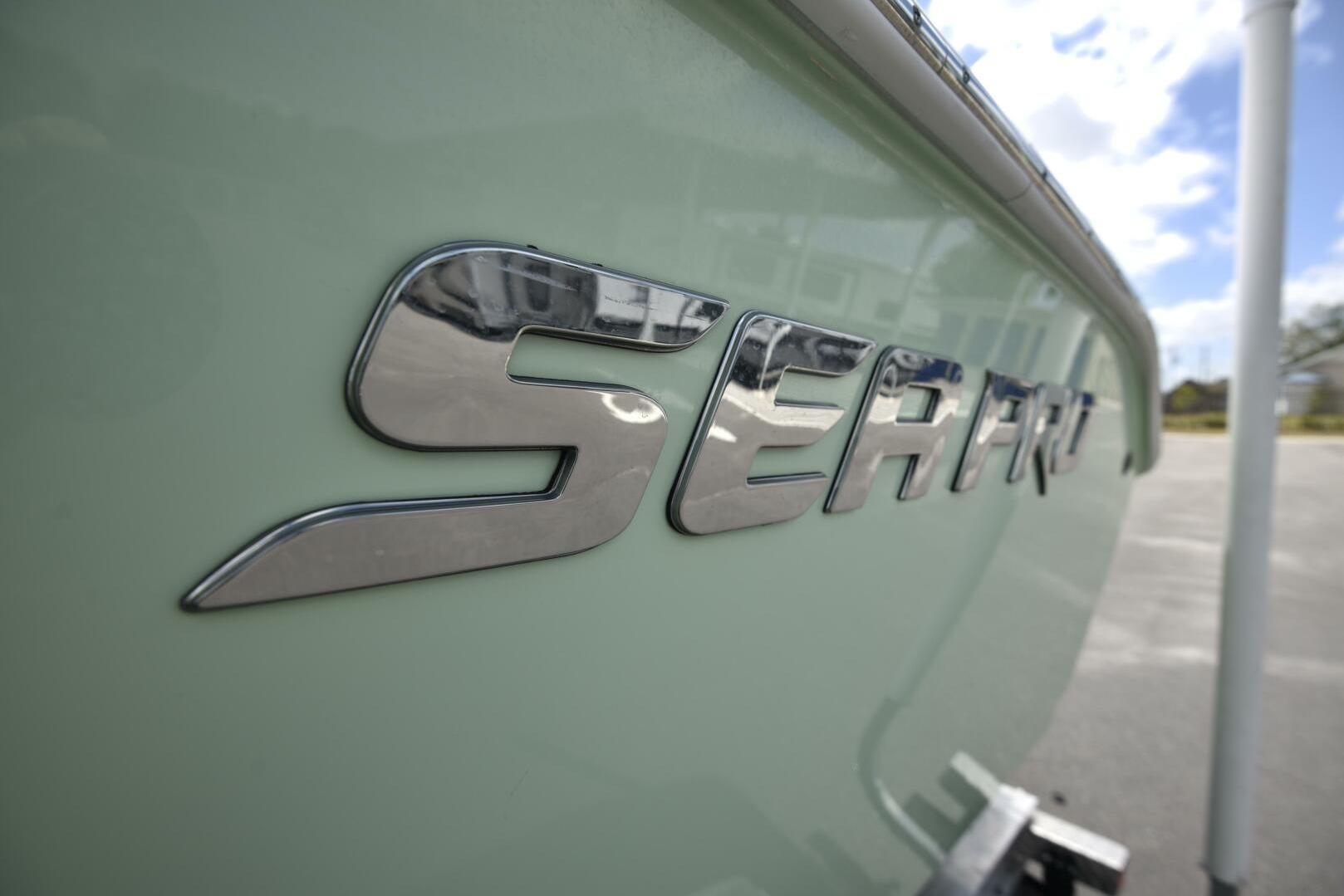 2023 Sea Pro 239 Deep V CC boat with chrome logo detail.