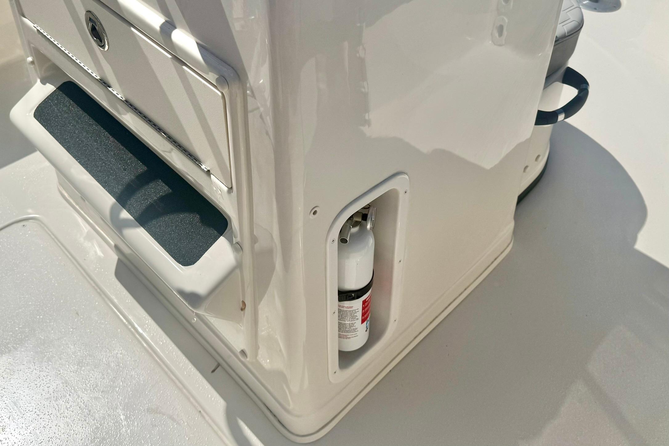 2026 Carolina Skiff 21 Ultra Elite boat console with integrated fire extinguisher.
