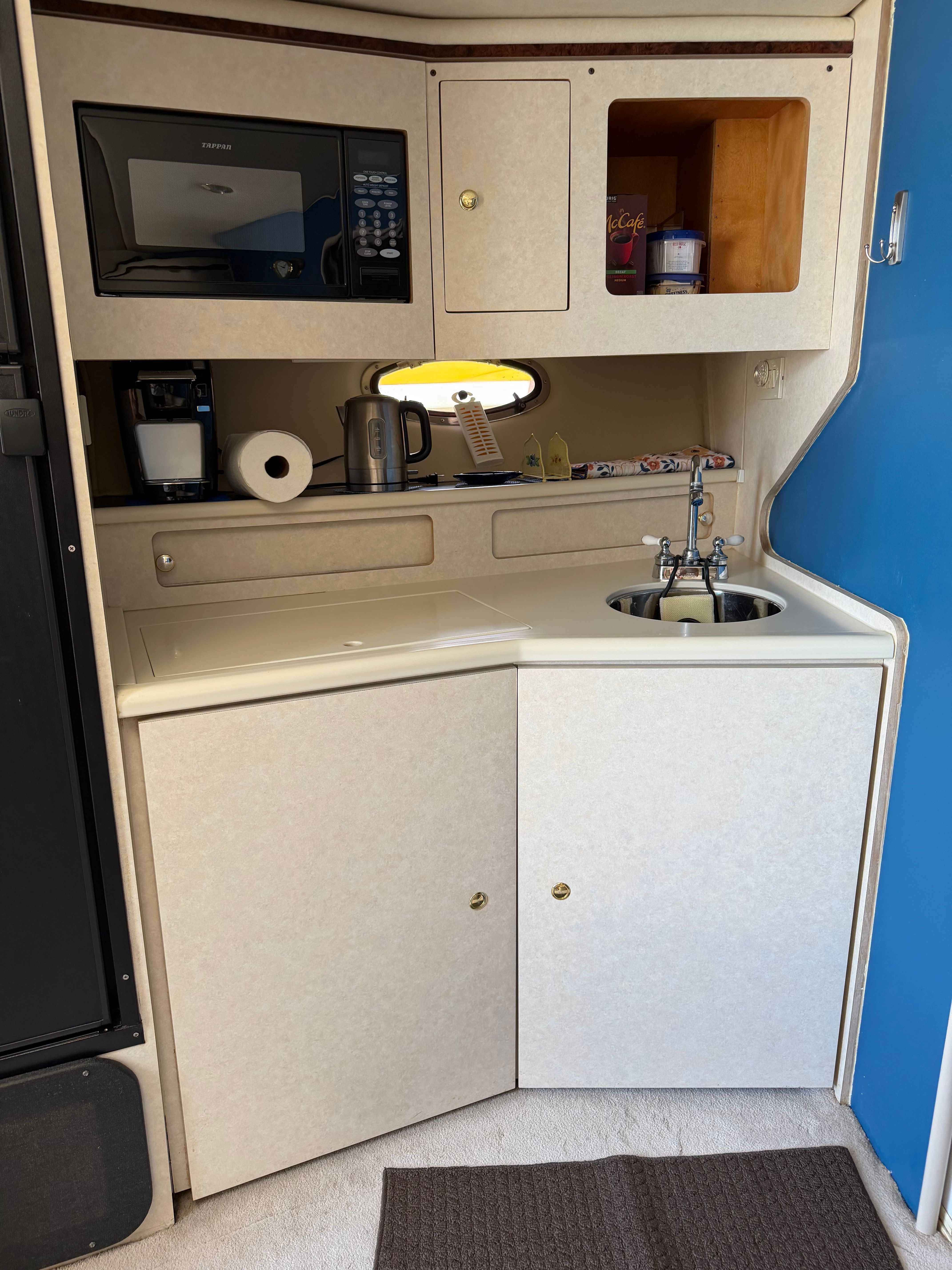 Kitchen area in a 1997 Regal Commodore yacht.