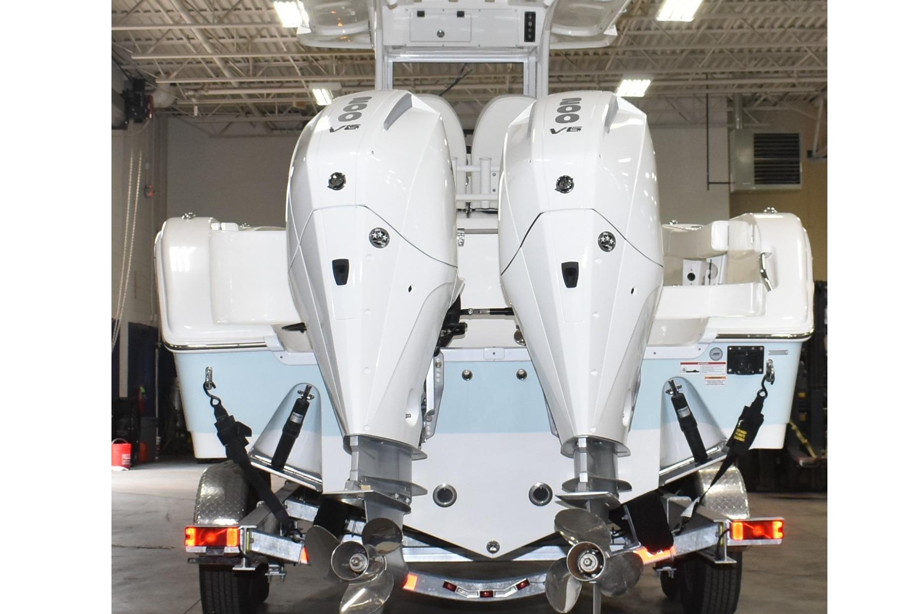 2025 Sea Pro 262 Offshore boat with dual 600 V8 engines in a garage setting.