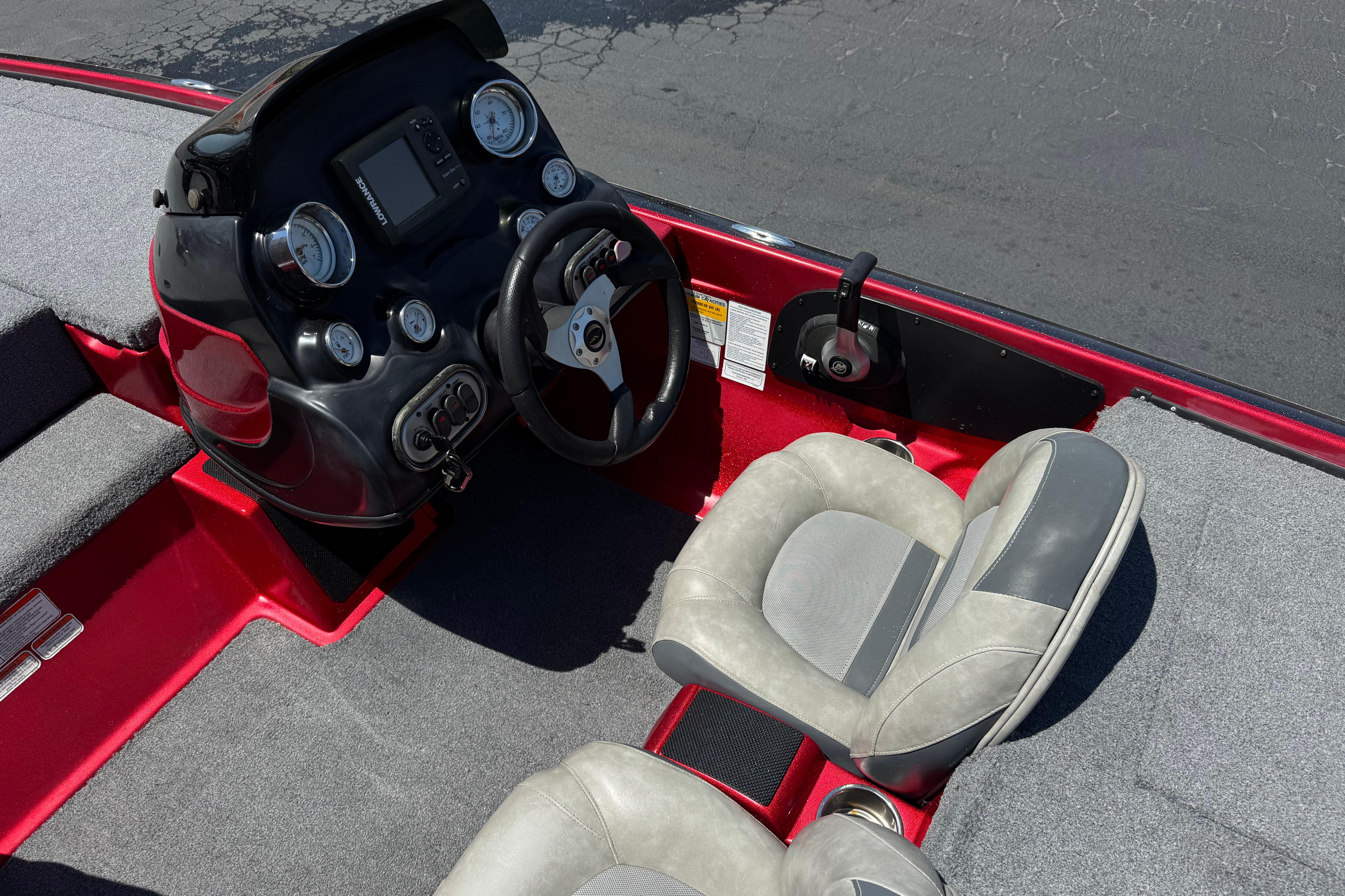 Interior of a 2012 Nitro Z-7 boat featuring steering console and seating.