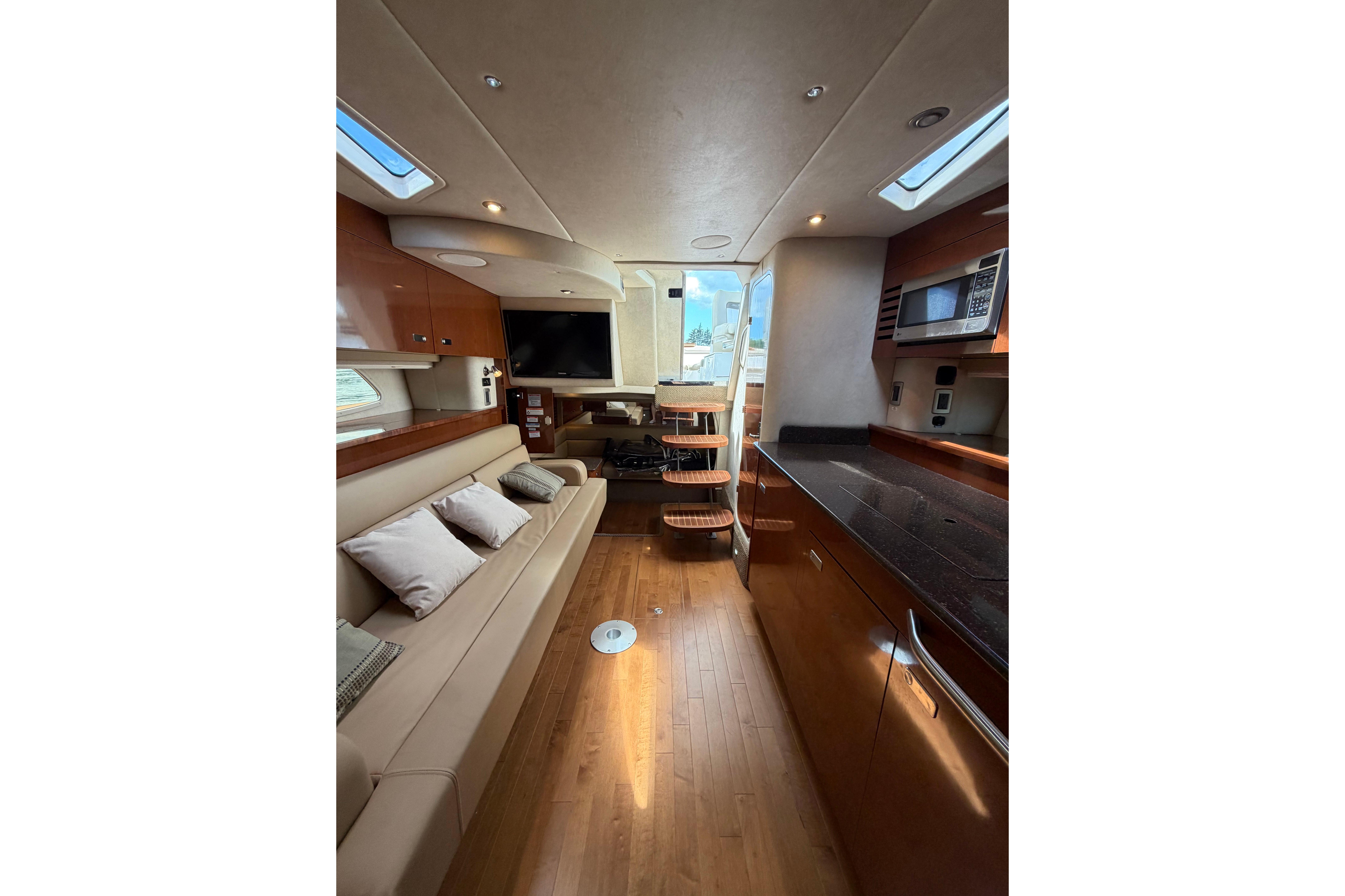 Luxurious interior of 2012 Sea Ray Sundancer 370 yacht with modern amenities and elegant design.