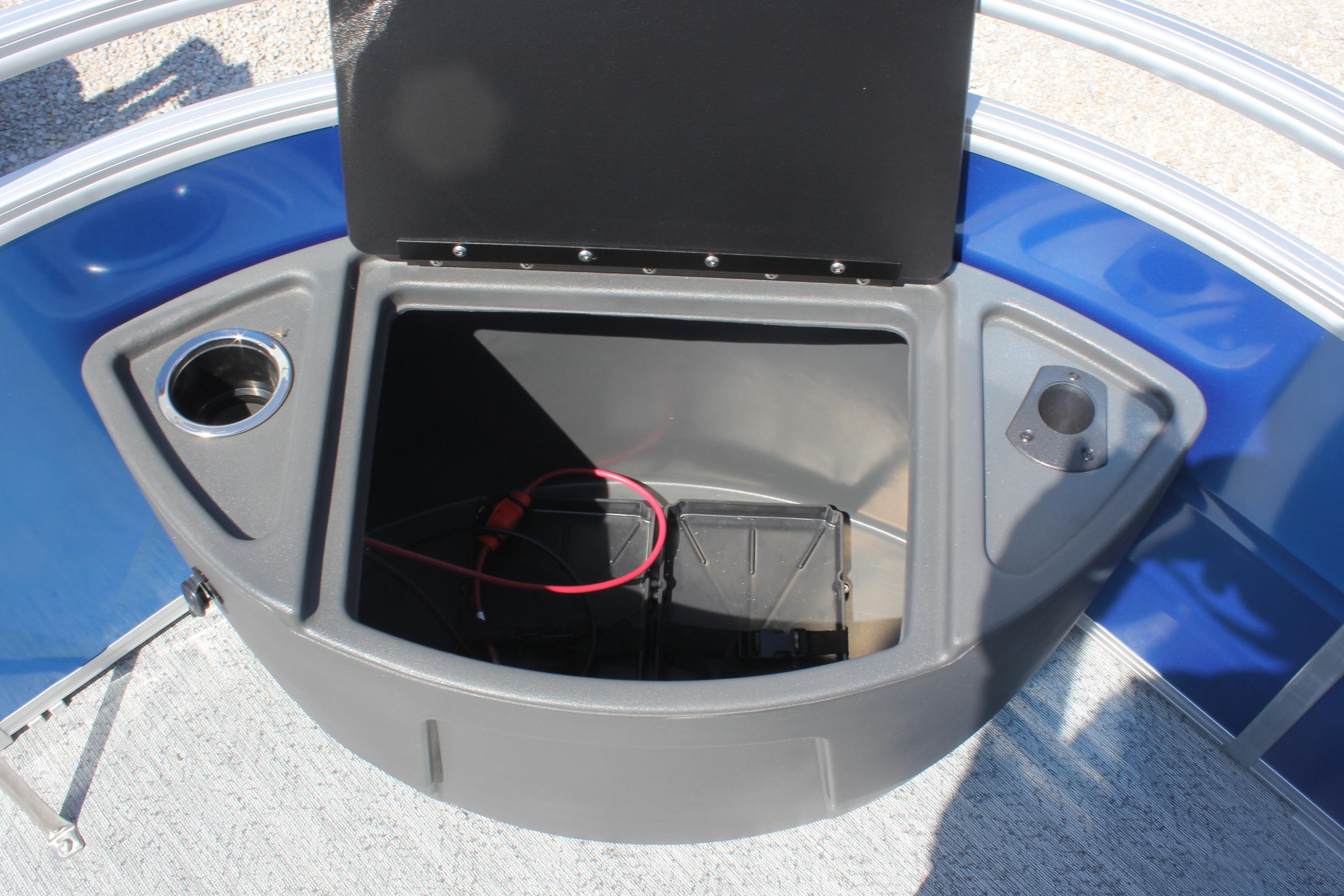 2026 Sun Tracker Fishin' Barge 20 DLX storage compartment with cup holder and wiring.