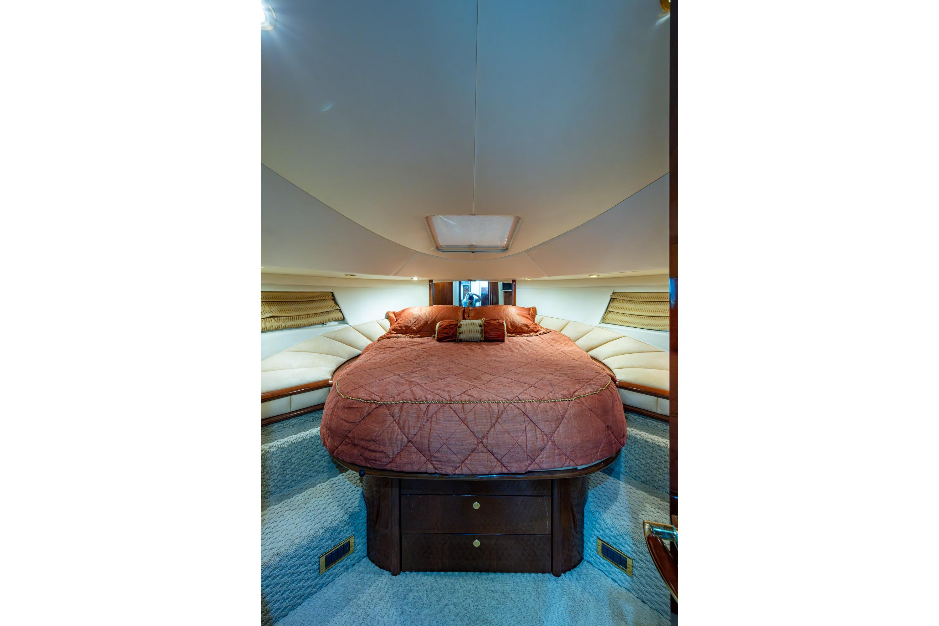 Luxurious cabin interior of 2000 Fairline Squadron 52 yacht with plush bedding.