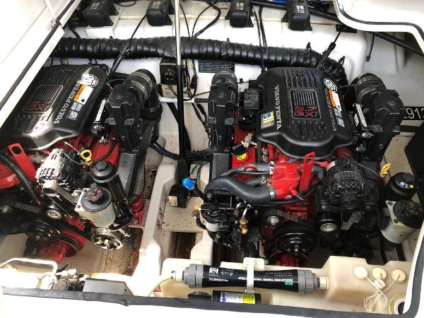 Two engines in a boat's engine room, clean and well-maintained.