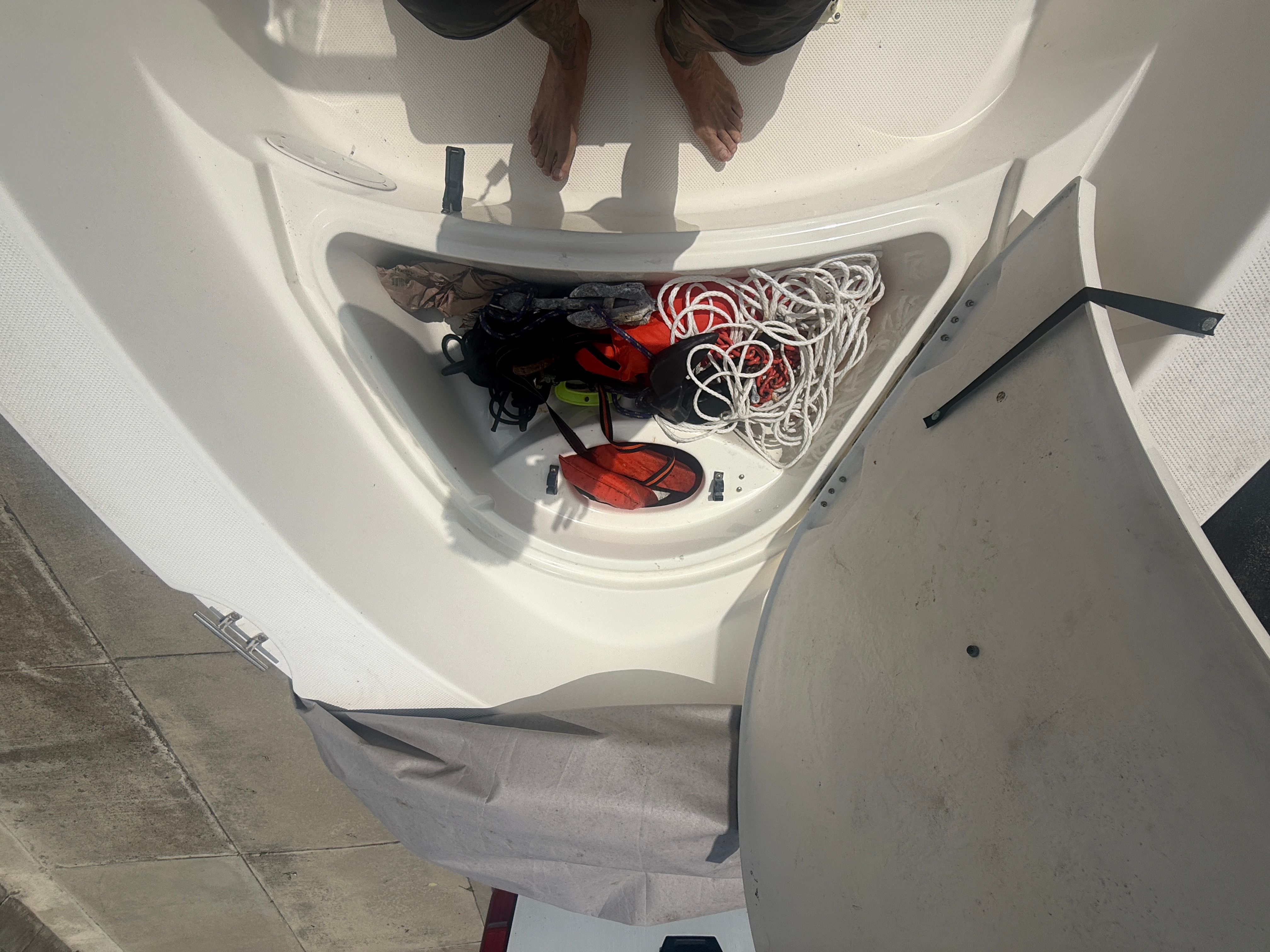 Open storage compartment of a 2008 Trophy 1703 Center Console boat.