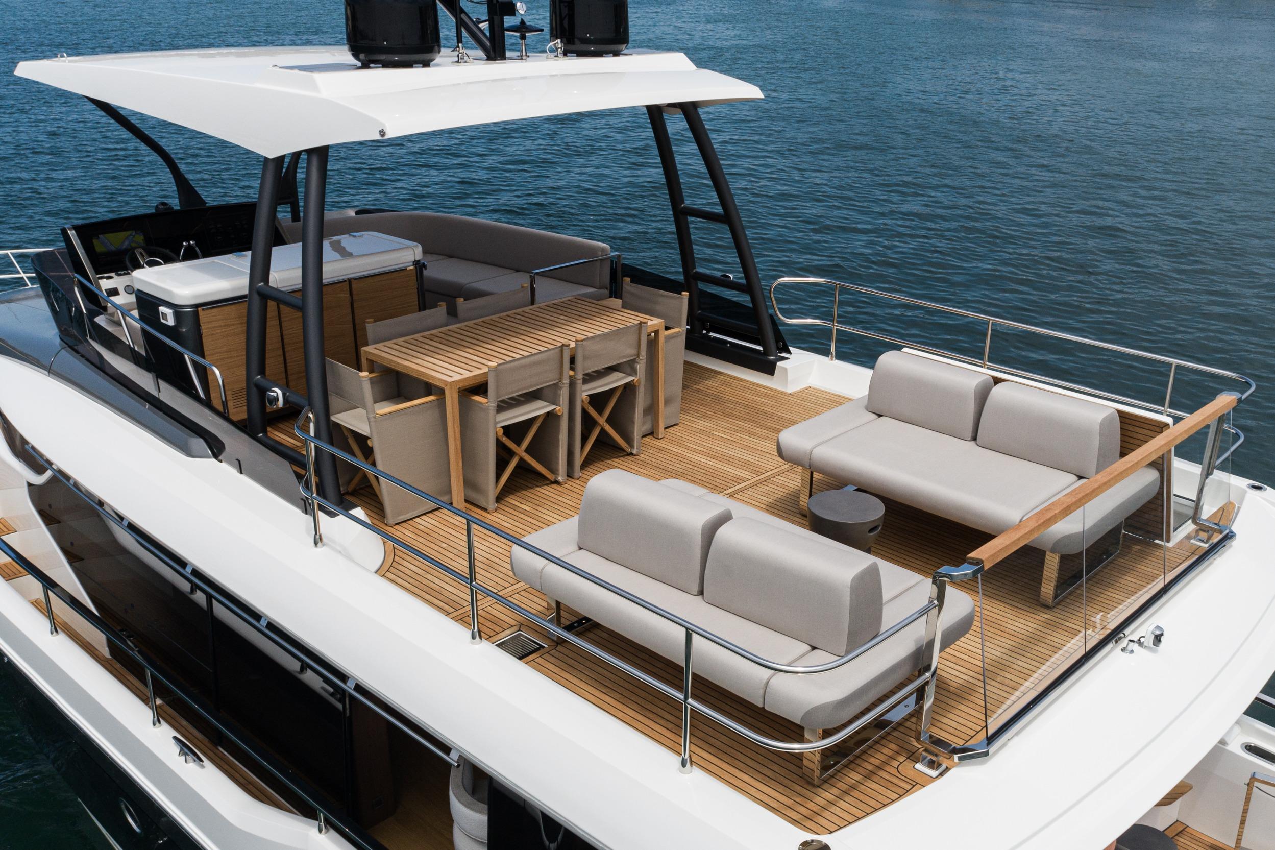 Luxurious 2024 Prestige X60 yacht deck with elegant seating and dining area.