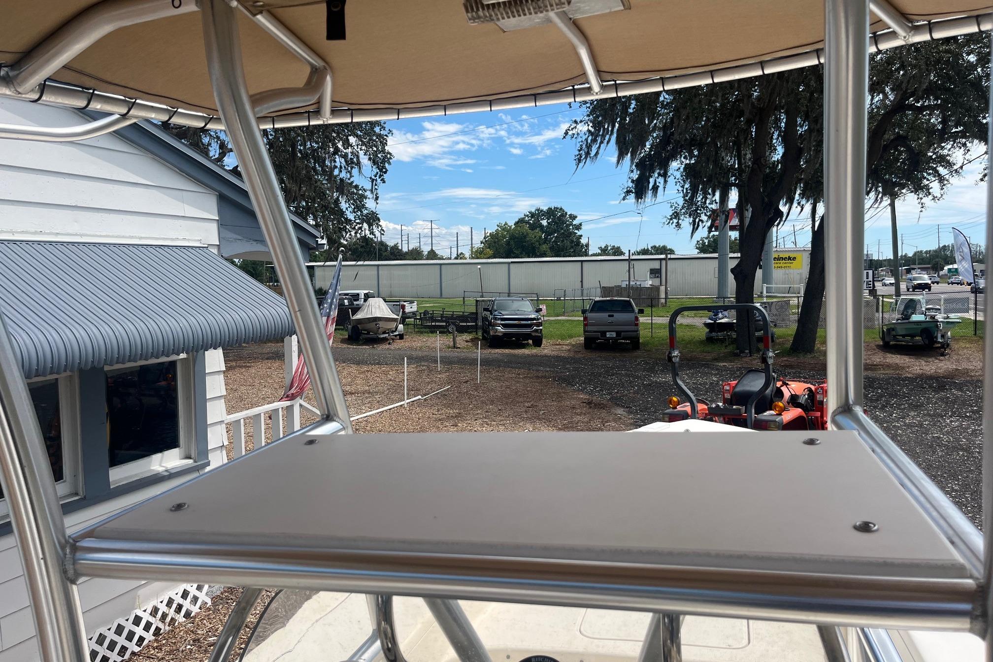 View from 2009 Scout 221 Winyah Bay boat, showcasing outdoor dealership scene.