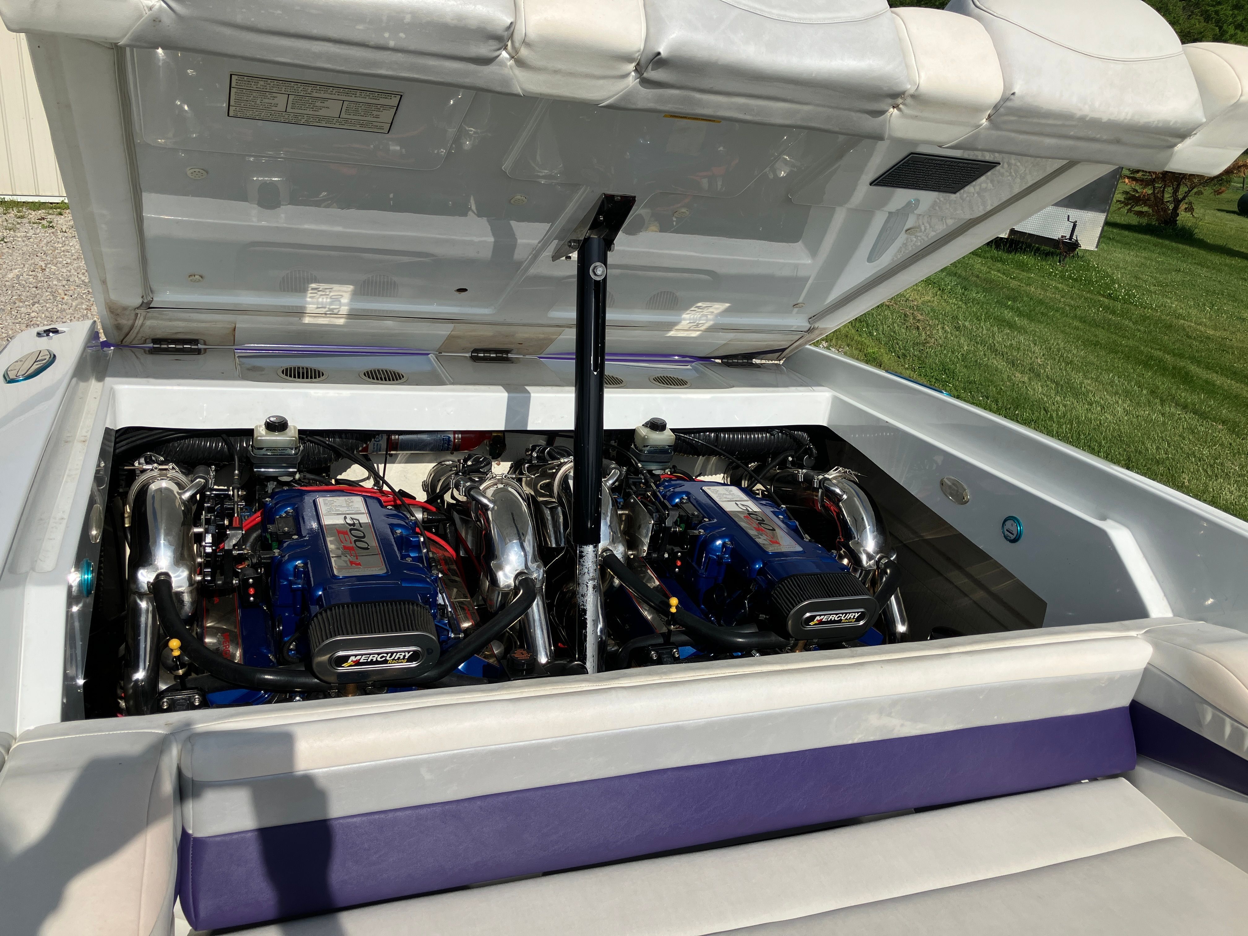 Engine compartment of a 2000 Baja 36 Outlaw boat.