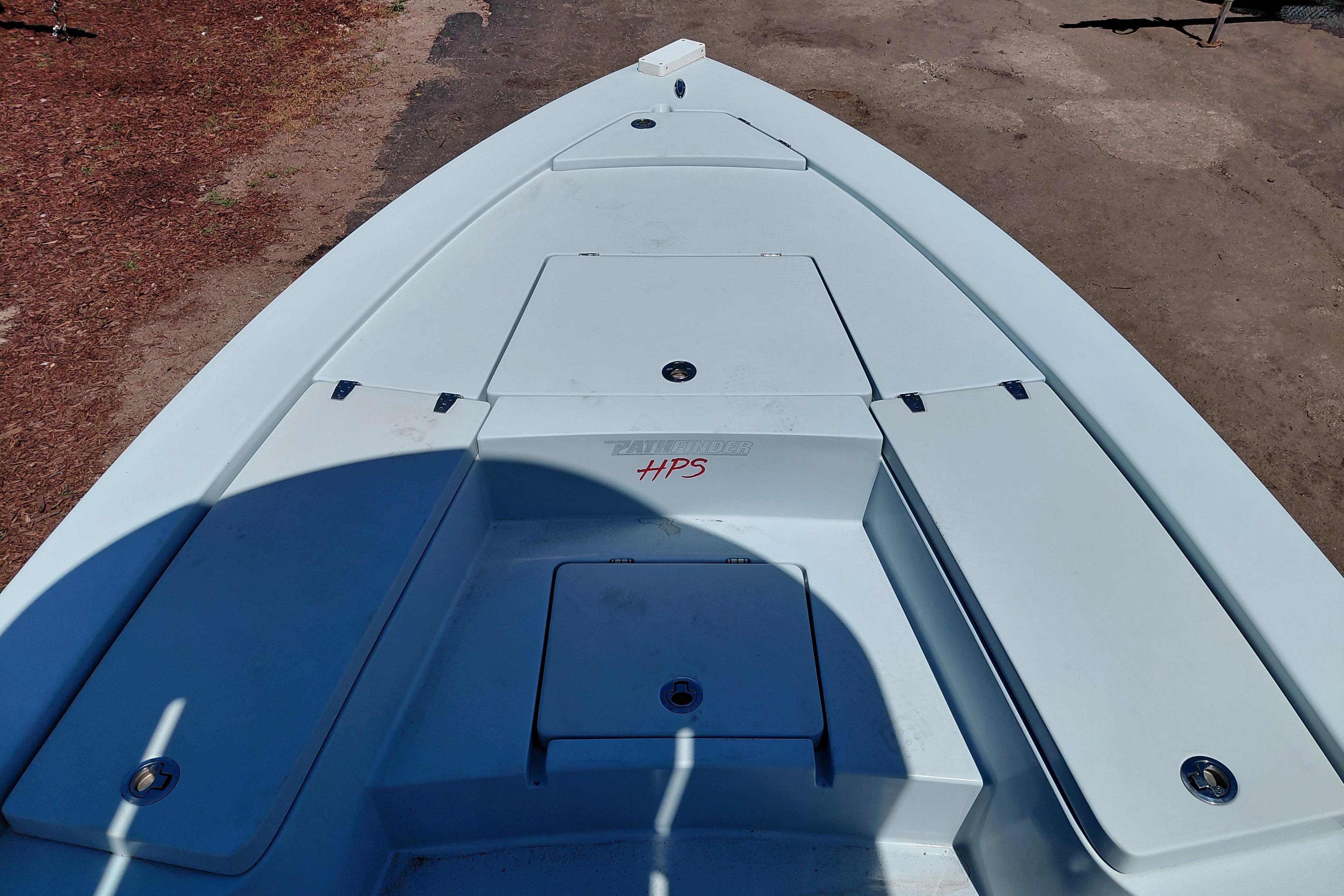 2022 Pathfinder 2300 HPS boat deck, featuring storage compartments and sleek design.