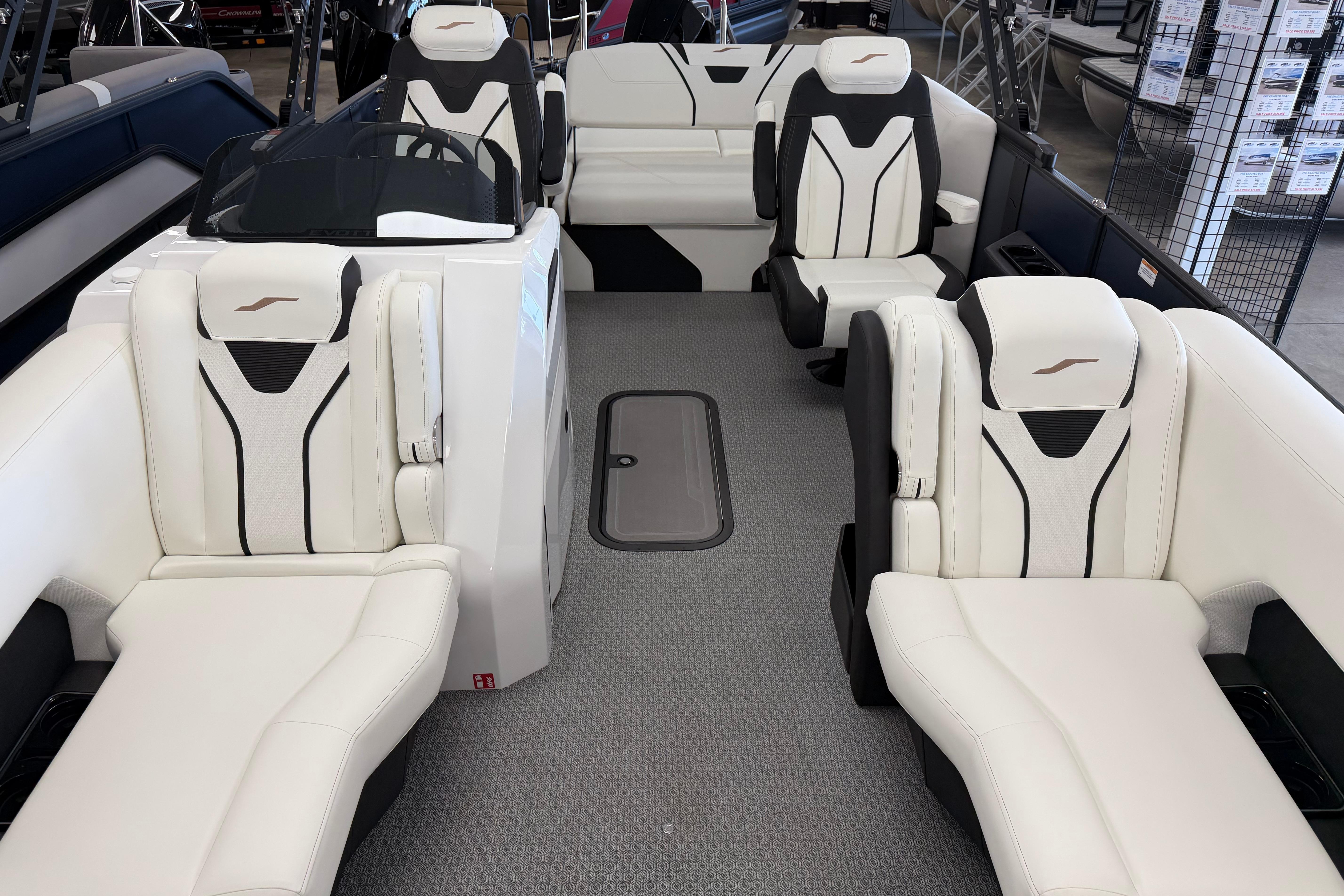 Luxurious interior of 2026 Evotti 721CS boat with modern white seating and sleek design.