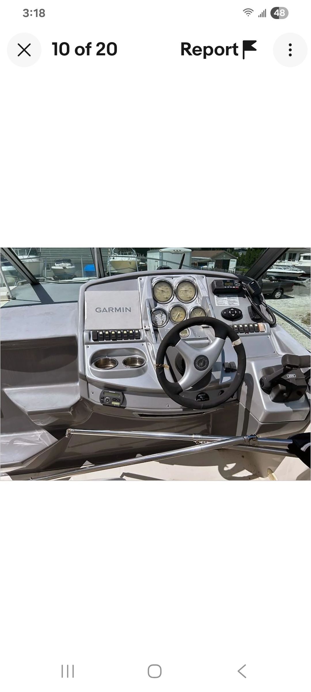 The cockpit of a Monterey 290 Cruiser with steering wheel and instruments.