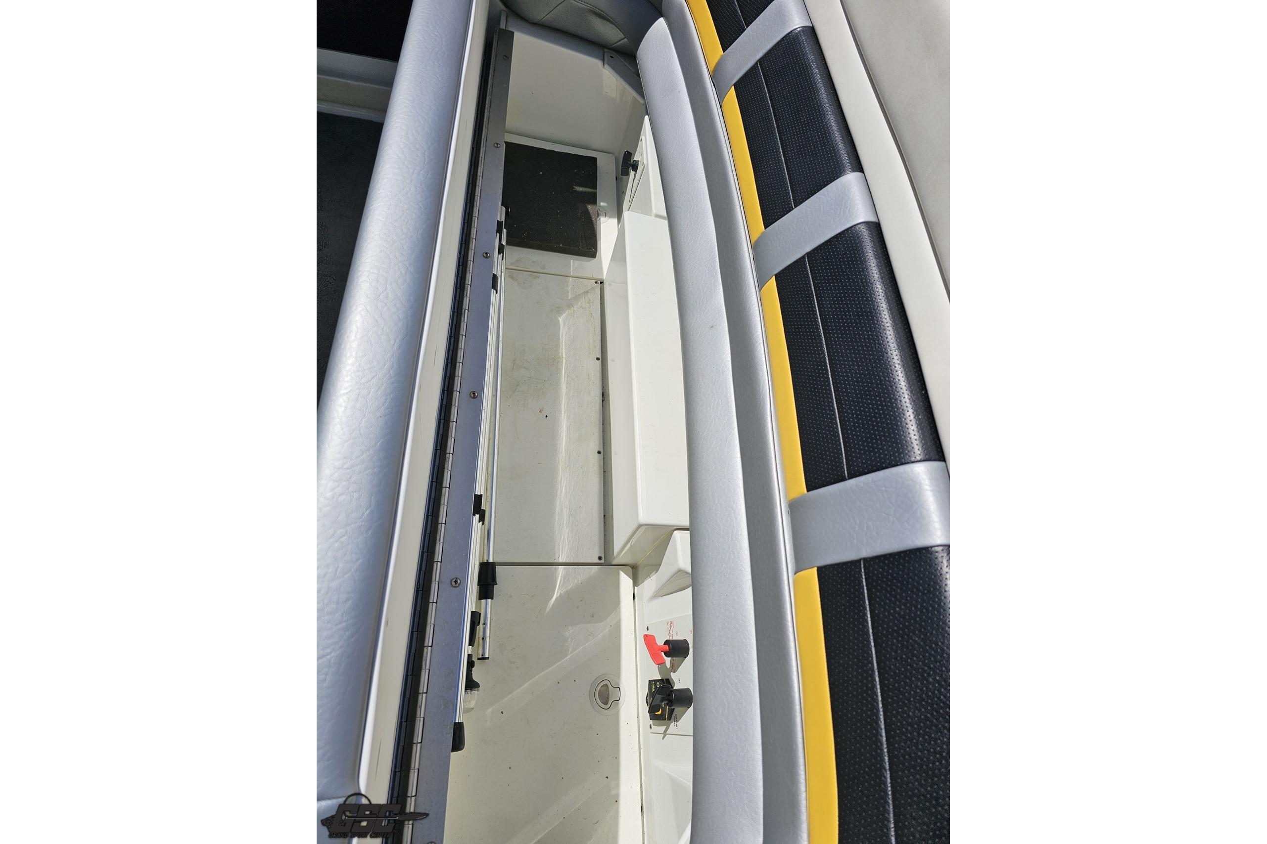 Interior view of a 2014 Formula 292 FASTech boat, showcasing seating and storage area.