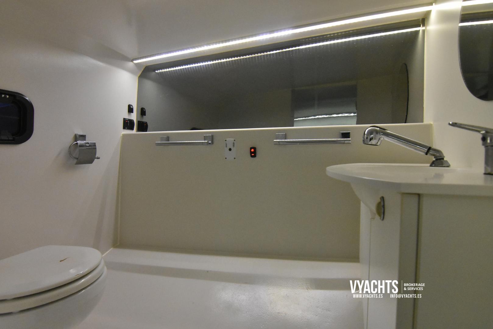 Luxurious bathroom interior of 2011 Frauscher 1017 GT yacht with modern fixtures and lighting.