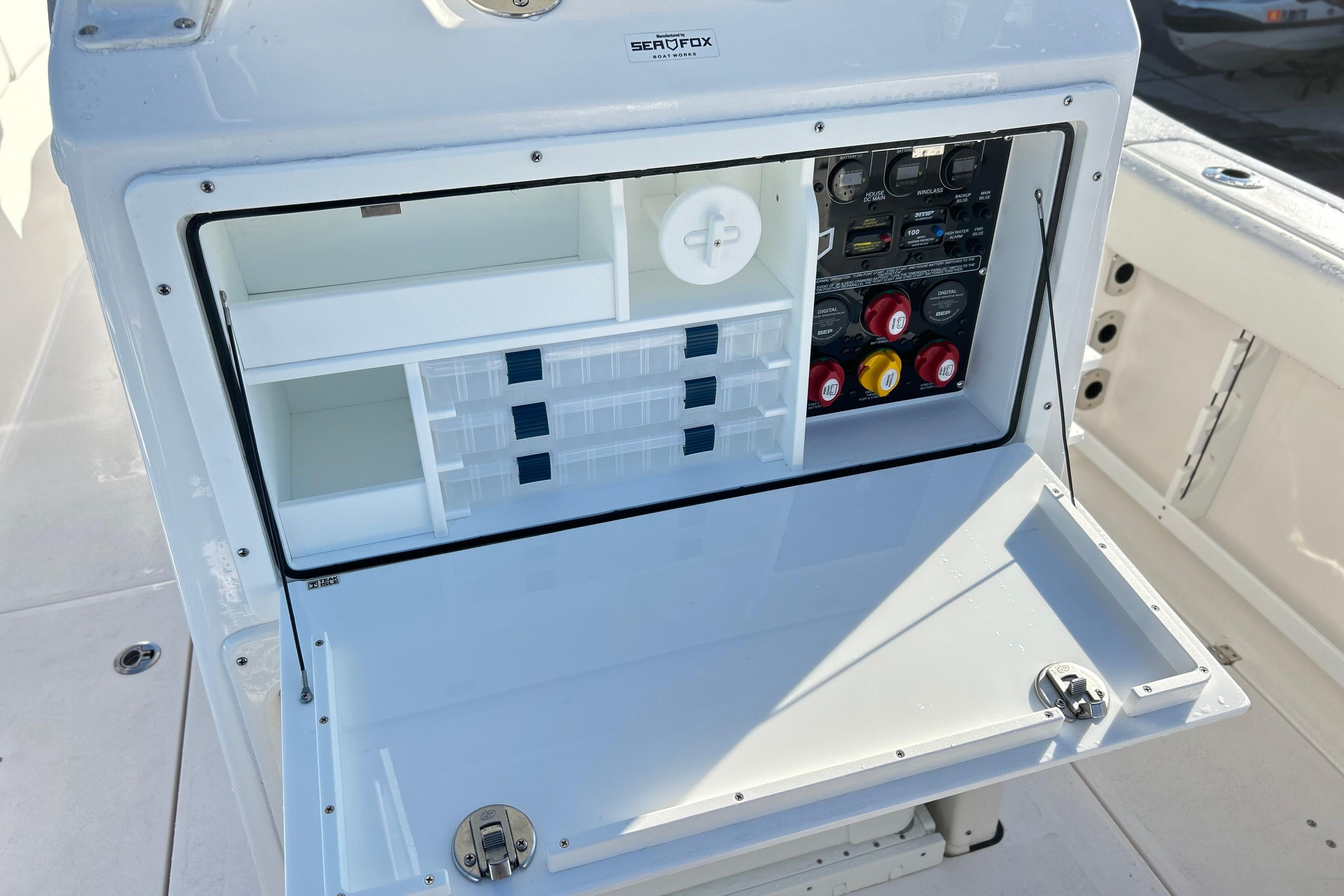 2026 Sea Fox 288 Commander boat console with storage compartments and control panel.