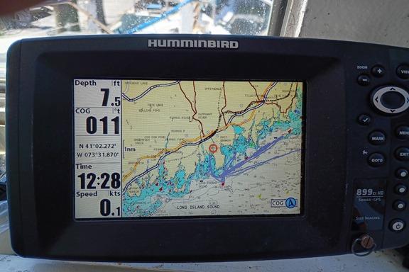 Humminbird GPS display on 1980 Thompson Passenger and Dive Trawler, showing navigation data and map.