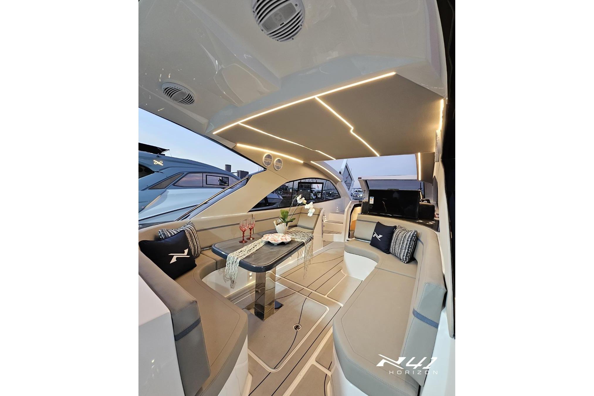 Luxurious interior of 2025 NX Boats NX41 HORIZON with elegant seating and ambient lighting.