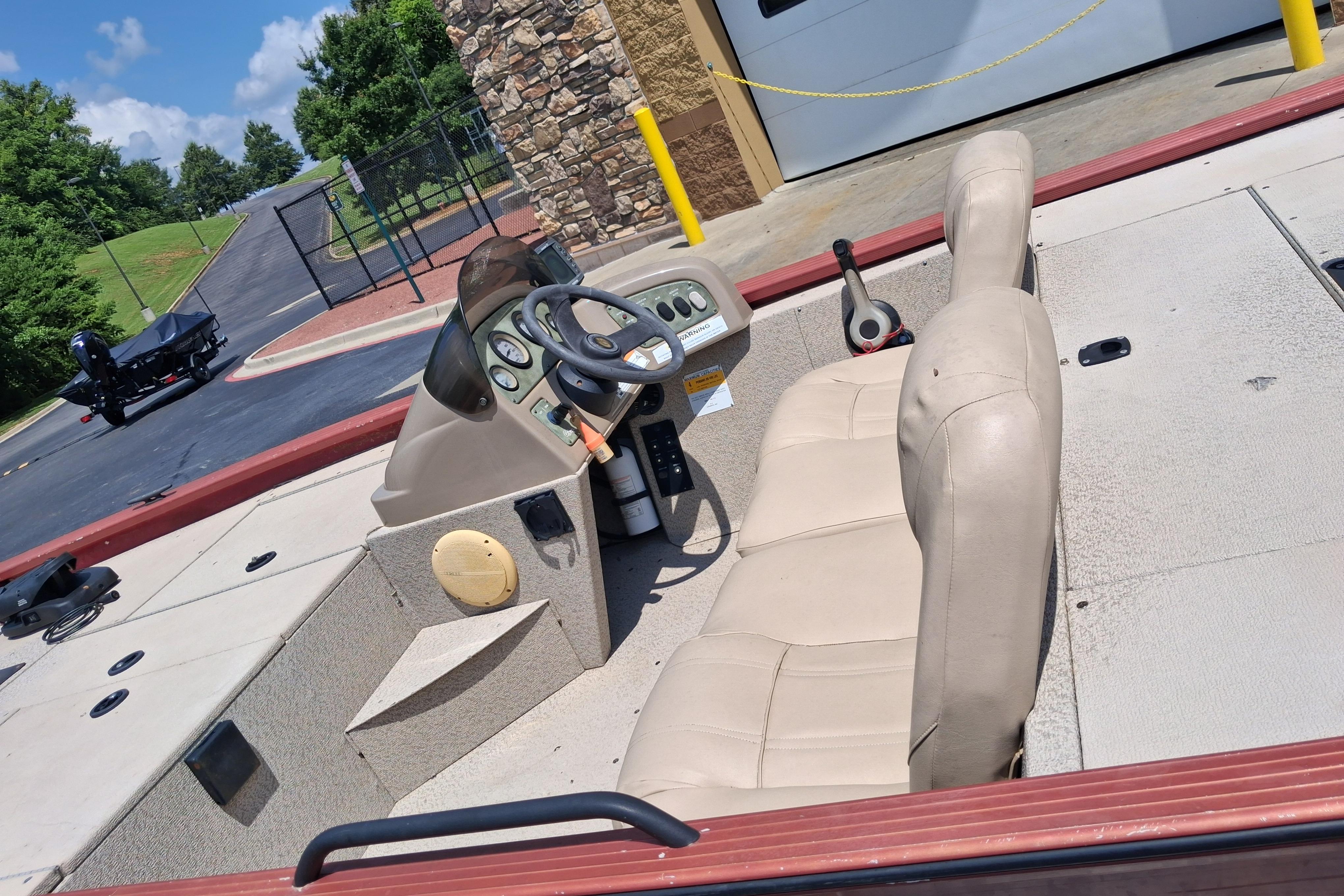 2008 G3 Eagle 175 boat interior with beige seats and steering console.
