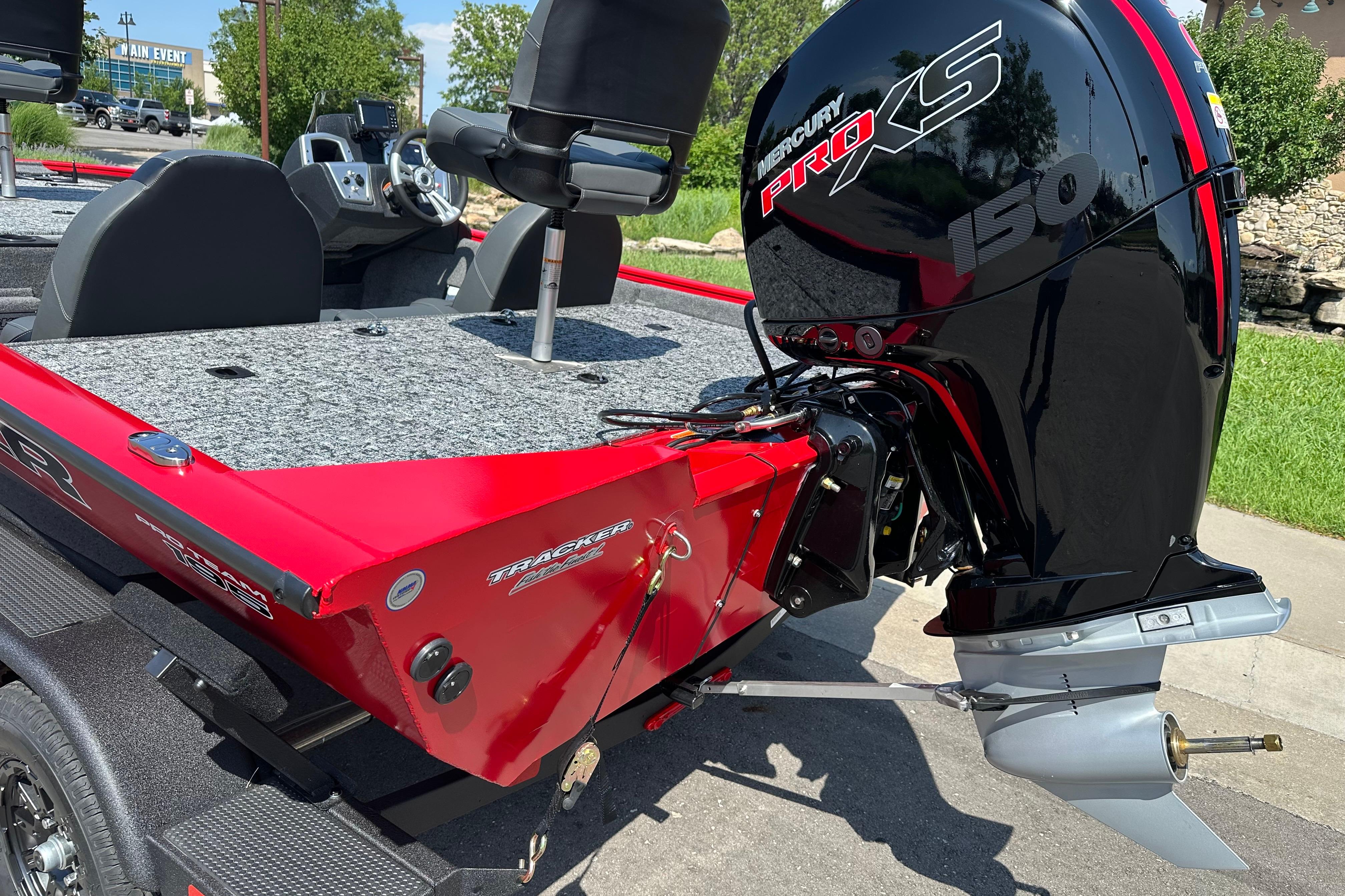 2026 Tracker Pro Team 195 boat with Mercury Pro XS 150 engine, parked outdoors.