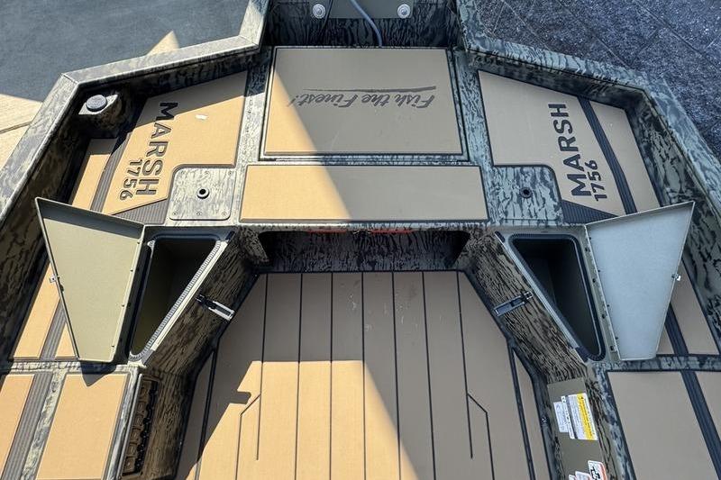 2026 Tracker Grizzly 1756 T Marsh boat interior with storage compartments open.