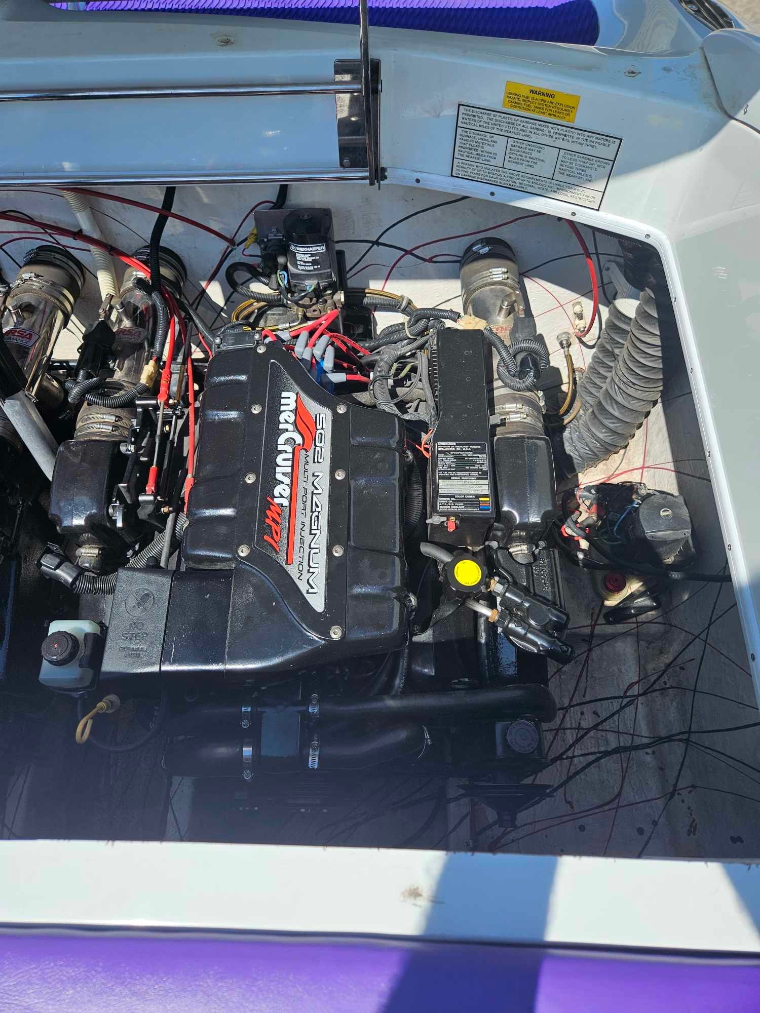 Engine compartment of a 1997 Baja 38 Special Boss boat.