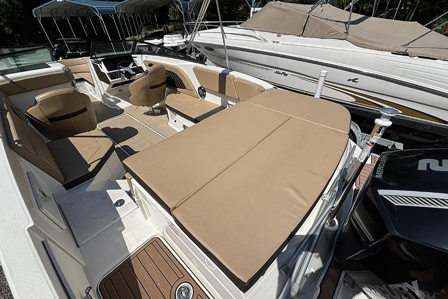 2019 Sea Ray SPX 230 Outboard boat interior with tan seating and modern design.