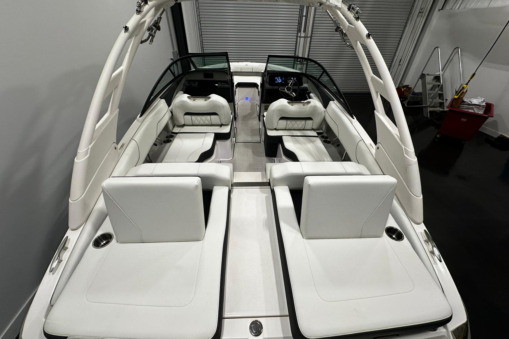 2025 Regal LS2 boat interior with white seating and sleek design in a showroom.