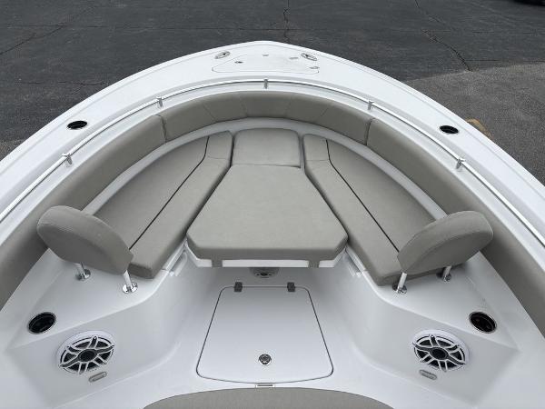 2025 Sportsman Open 232 boat interior with cushioned seating and speakers.