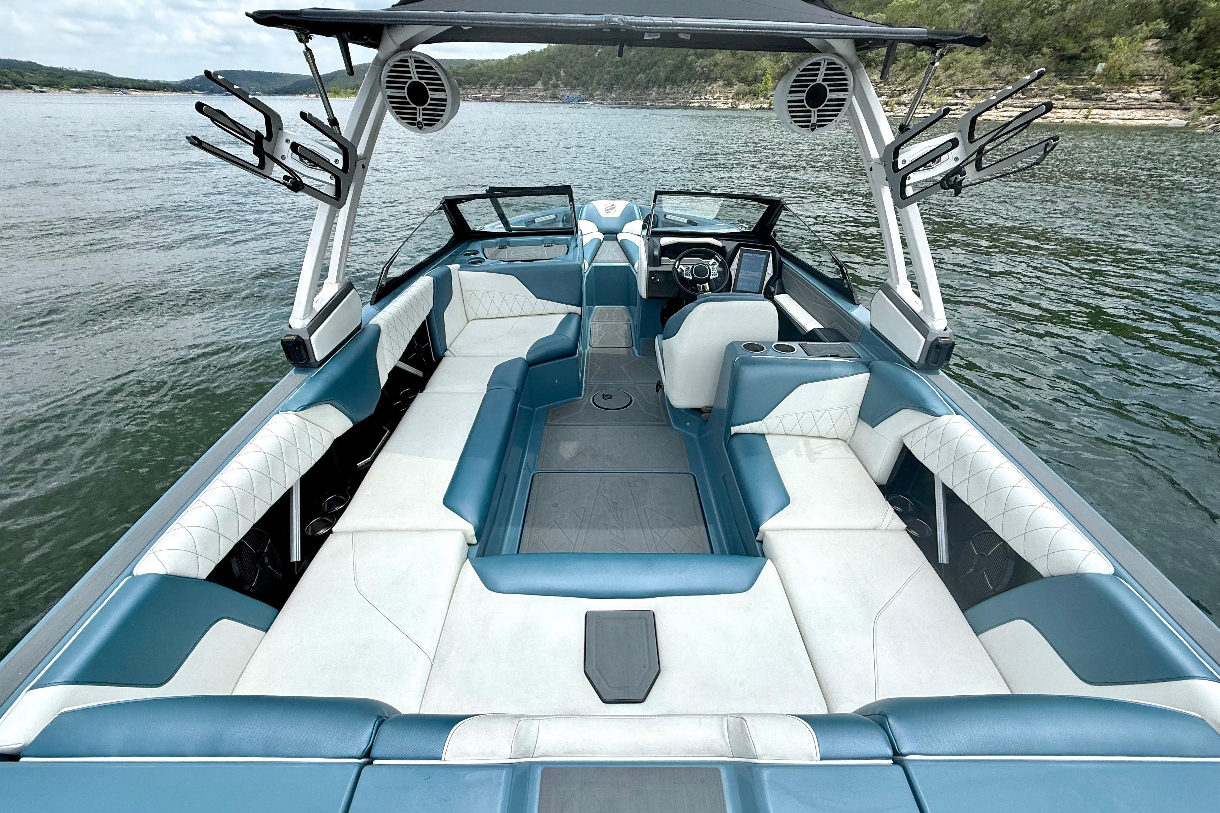 2021 Tige Z3 boat interior with blue and white seating on a lake.