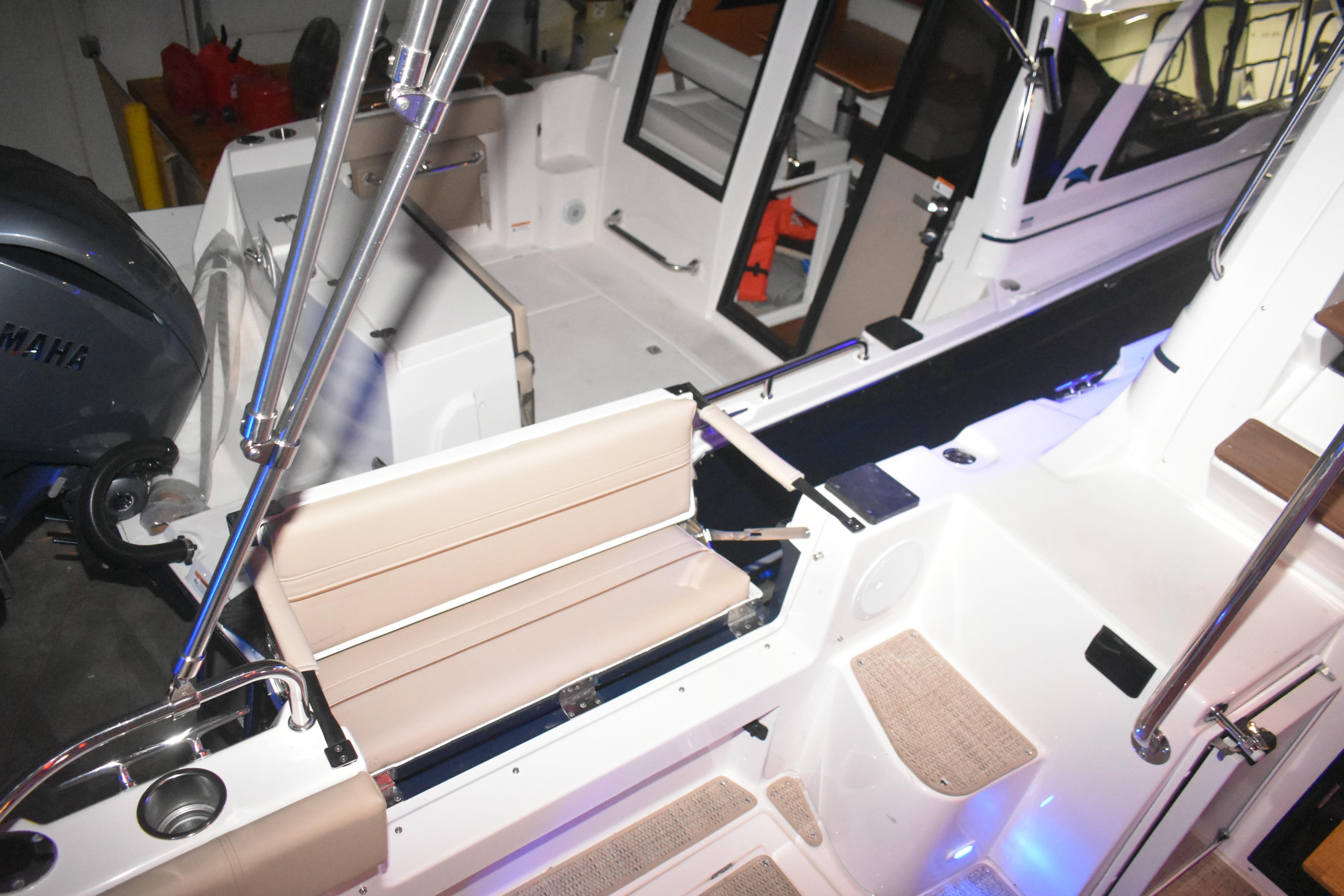 2026 Cutwater C-32 CB boat interior with seating and Yamaha engine.