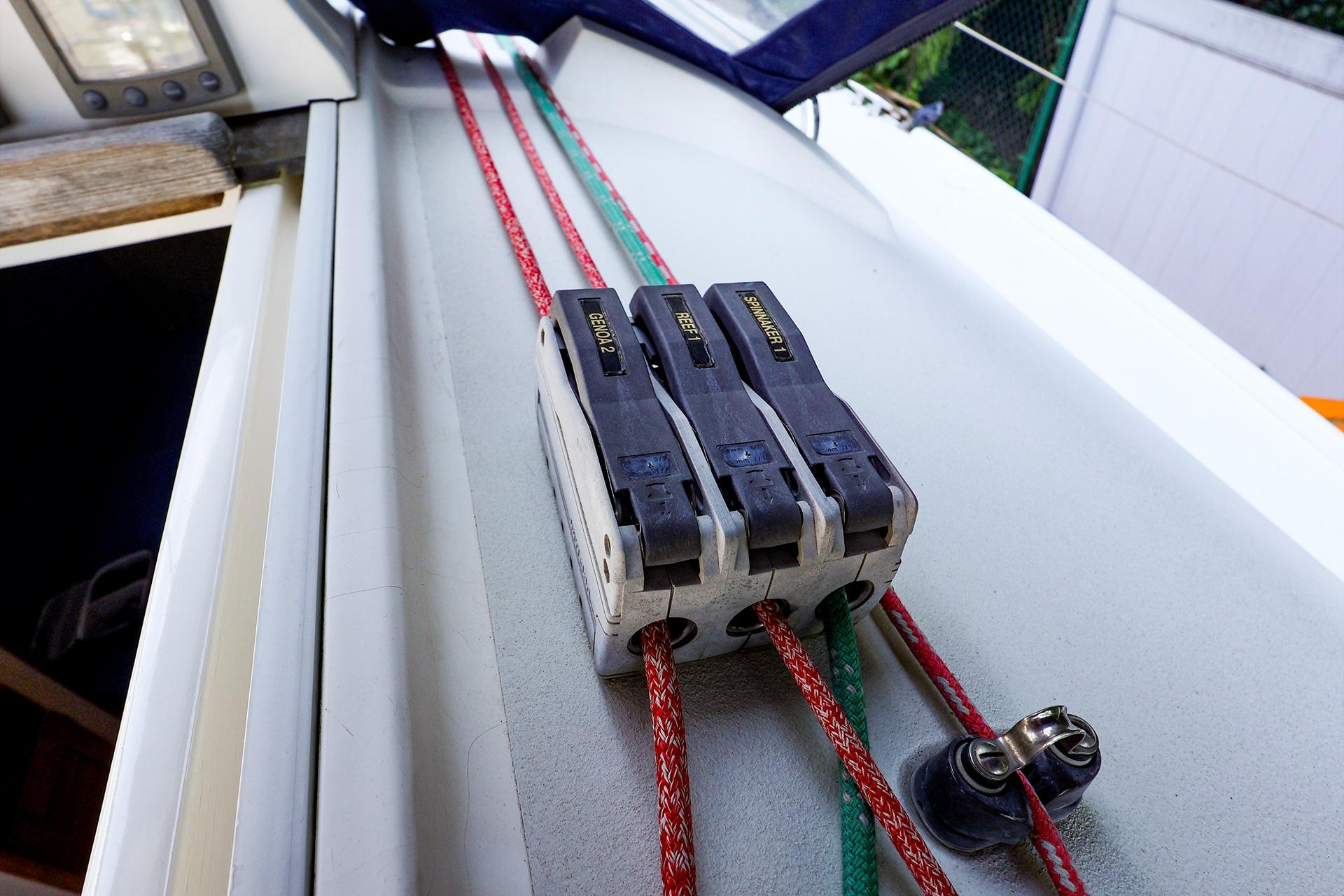 Close-up of a 2001 J Boats J/32 sailboat deck with rope clutches and lines.