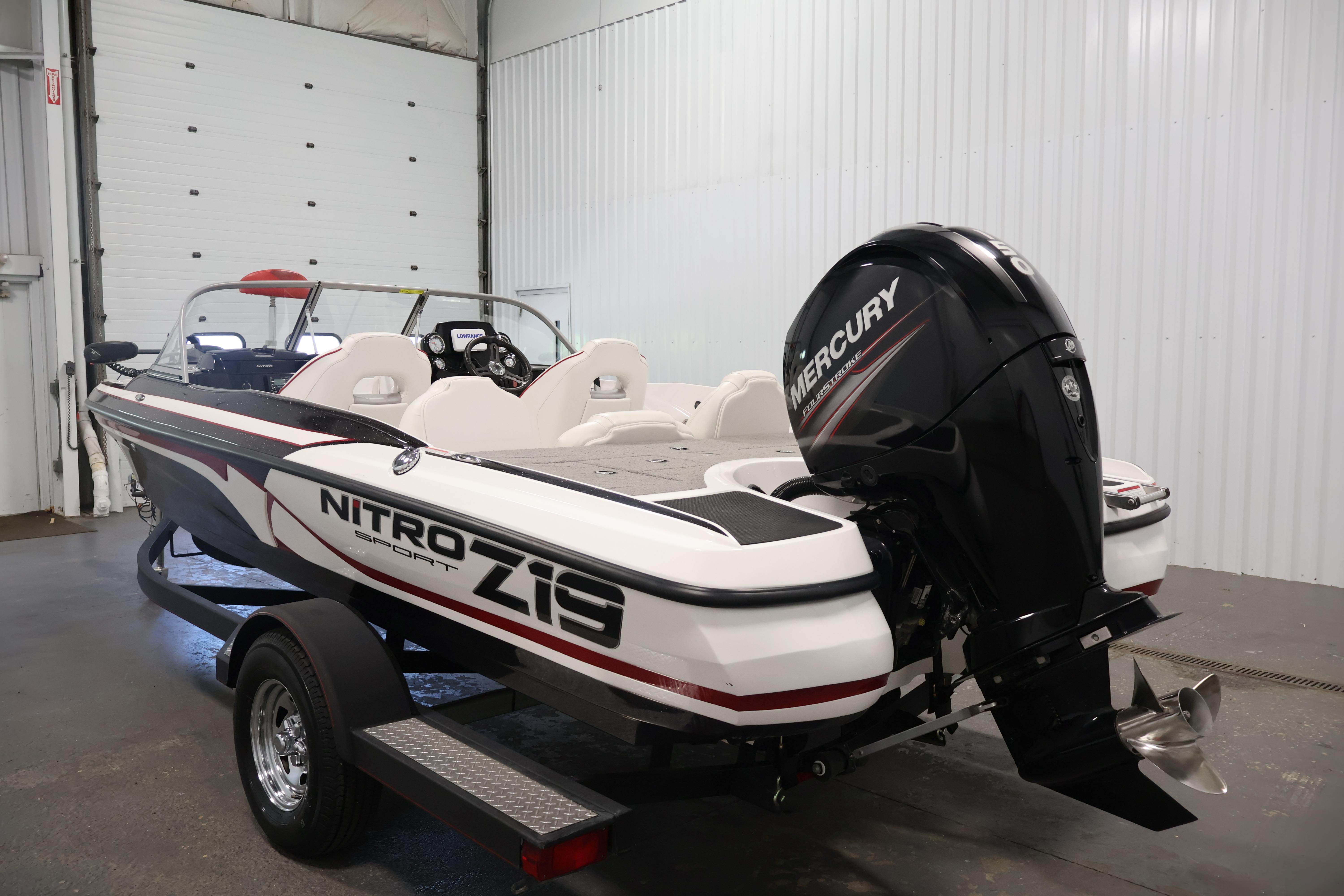 2019 Nitro Z19 Sport boat with Mercury engine in a garage setting.