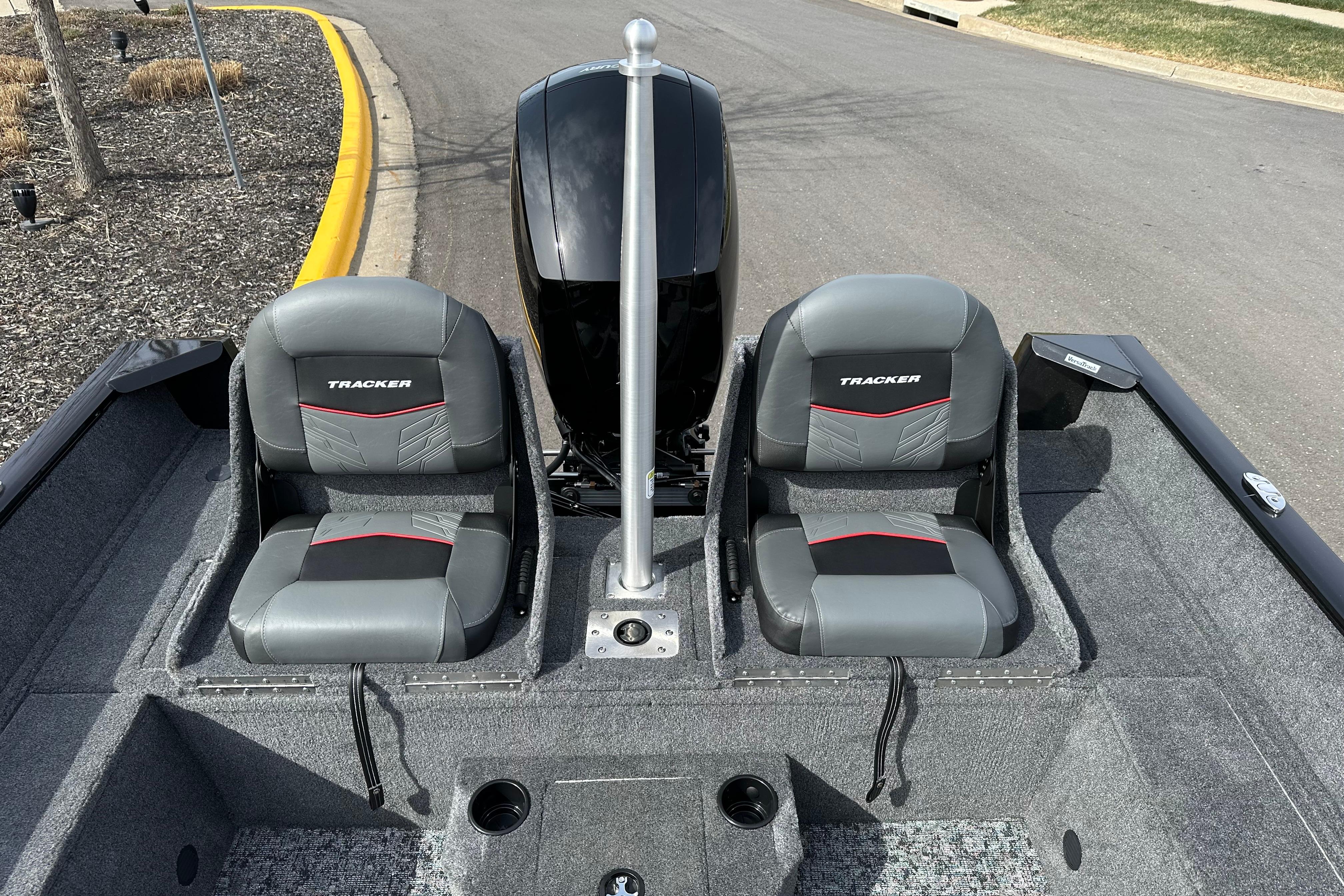 2026 Tracker Pro Guide V-175 Combo boat interior with two gray seats and motor.