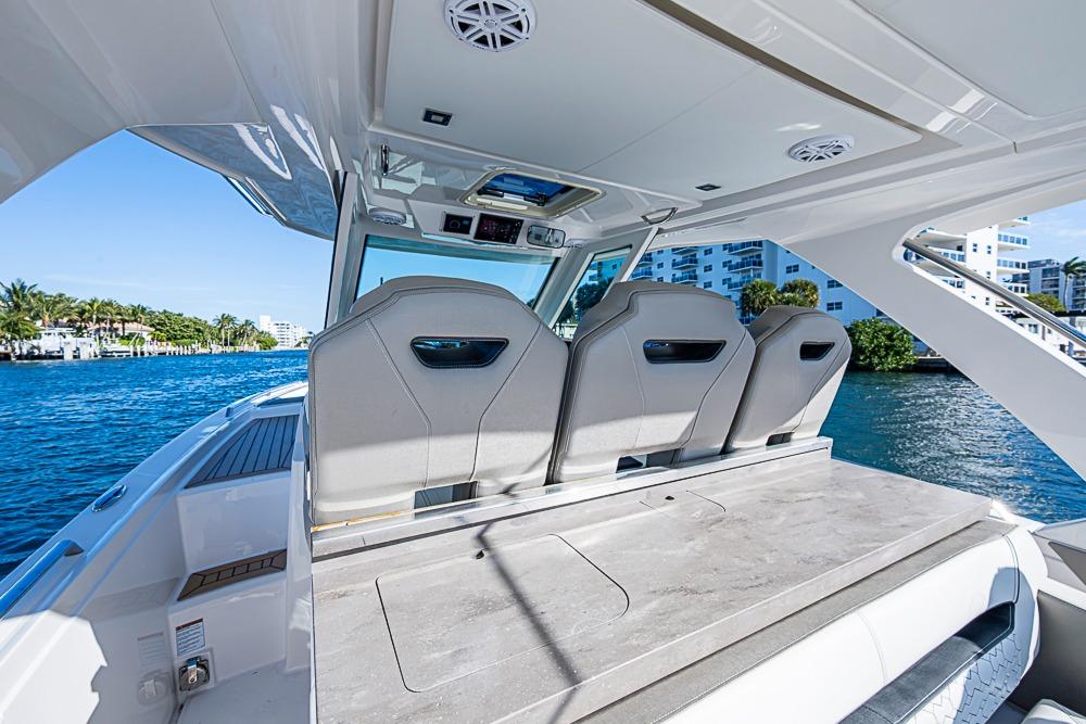 2023 Tiara Yachts 34 LS interior with sleek seating and waterfront view.