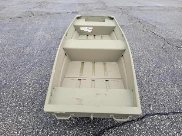 2025 Tracker Grizzly 1436 Utility boat on asphalt surface.