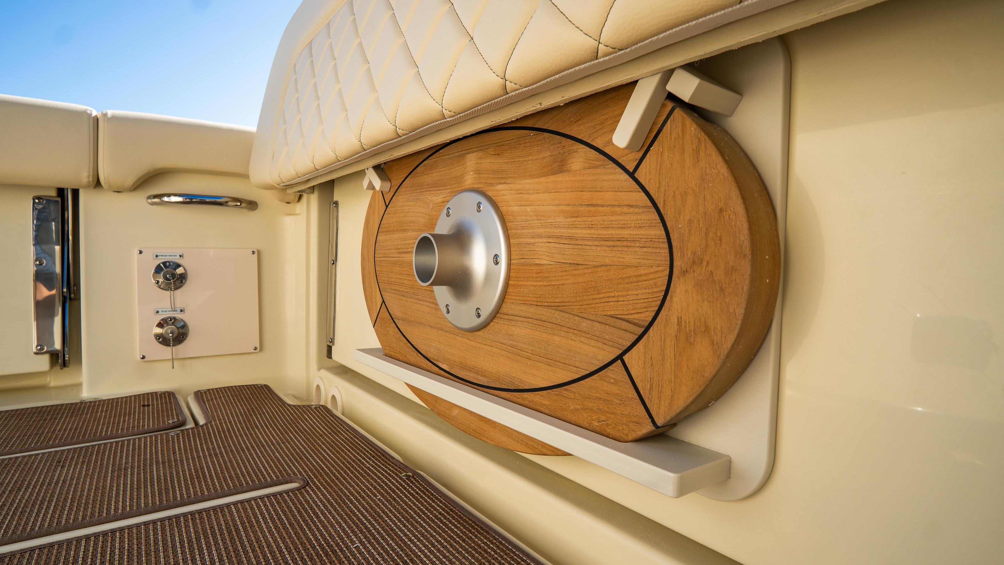 2025 Chris-Craft Catalina 30 interior detail with wooden accents and luxurious seating.