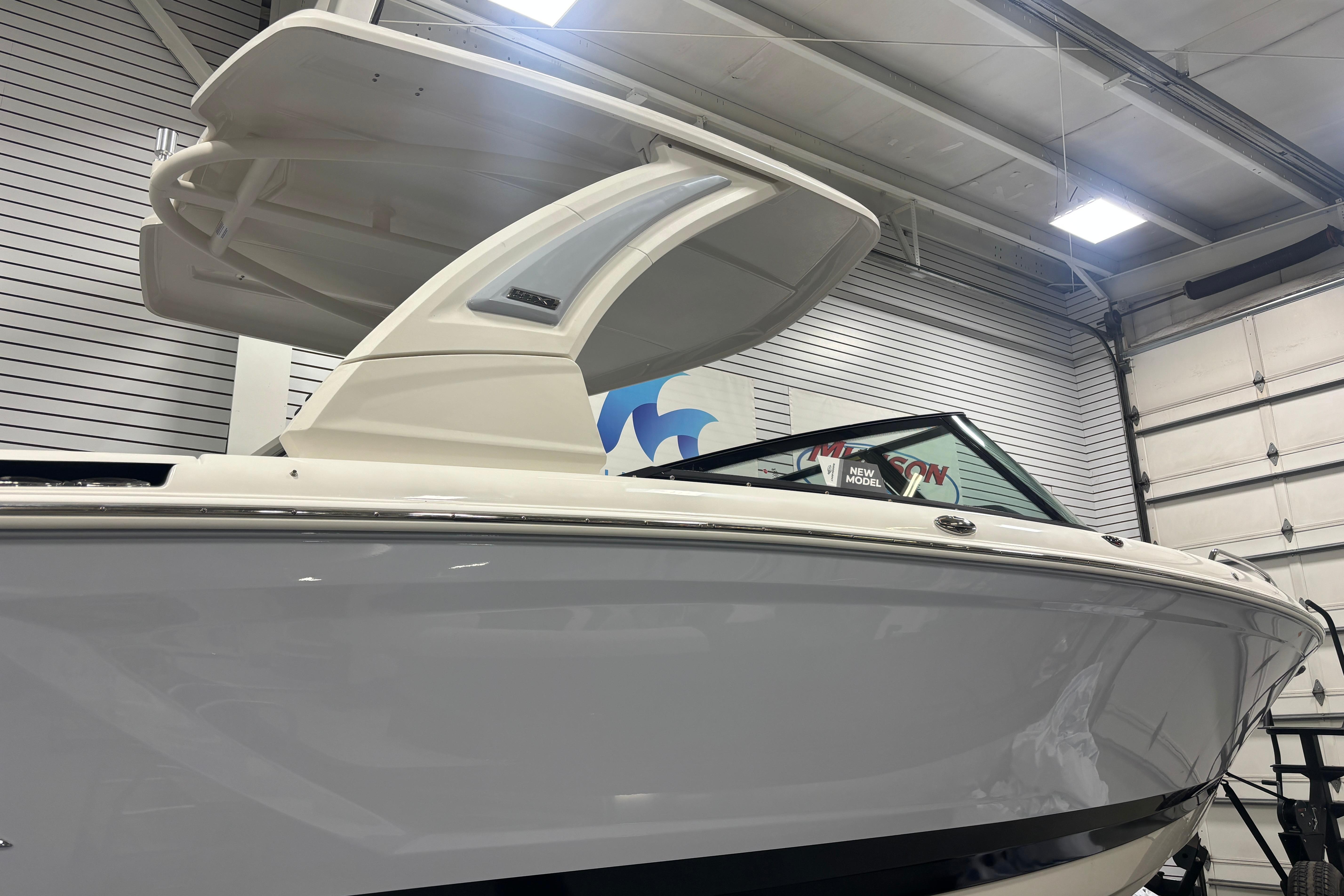 2026 Chaparral SSX 30 boat in showroom, showcasing sleek design and modern features.