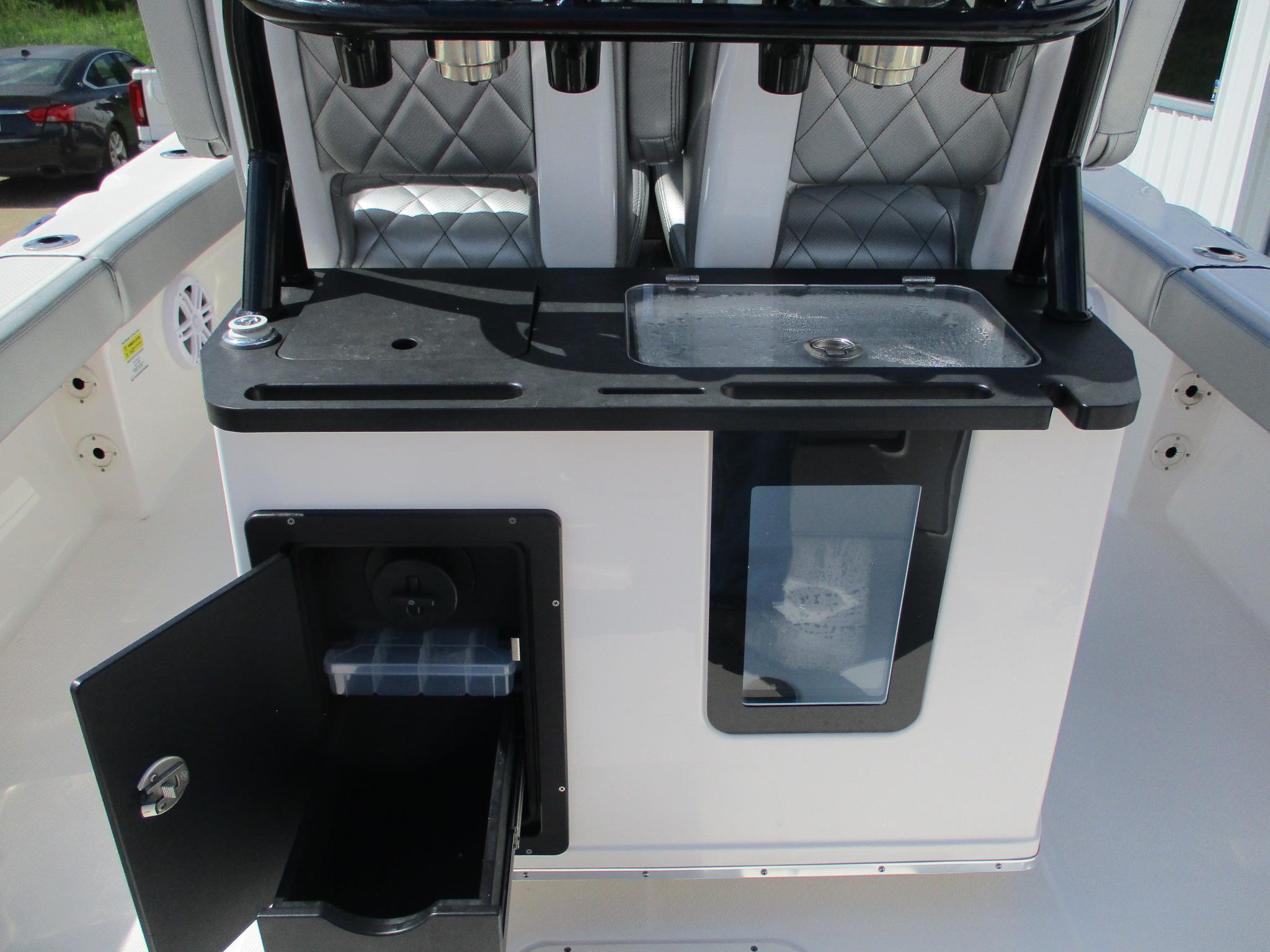 2024 Blue Wave 2800 Makaira boat interior with storage and seating features.